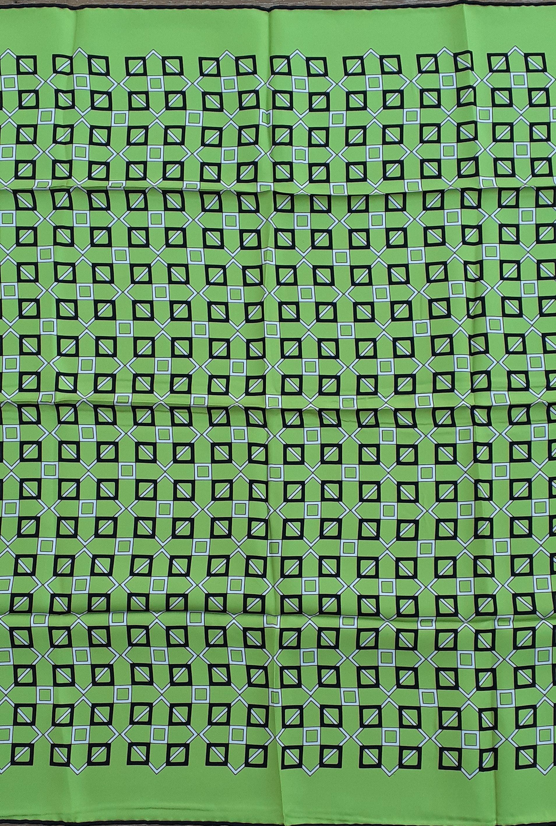 Beautiful Authentic Hermès Scarf

Geometric prints (squares)

From the men's collection; can fit both men and women

Made in France

Made of 100% Silk

Colorways: Apple Green background (more vibrant than photos show), White and Black