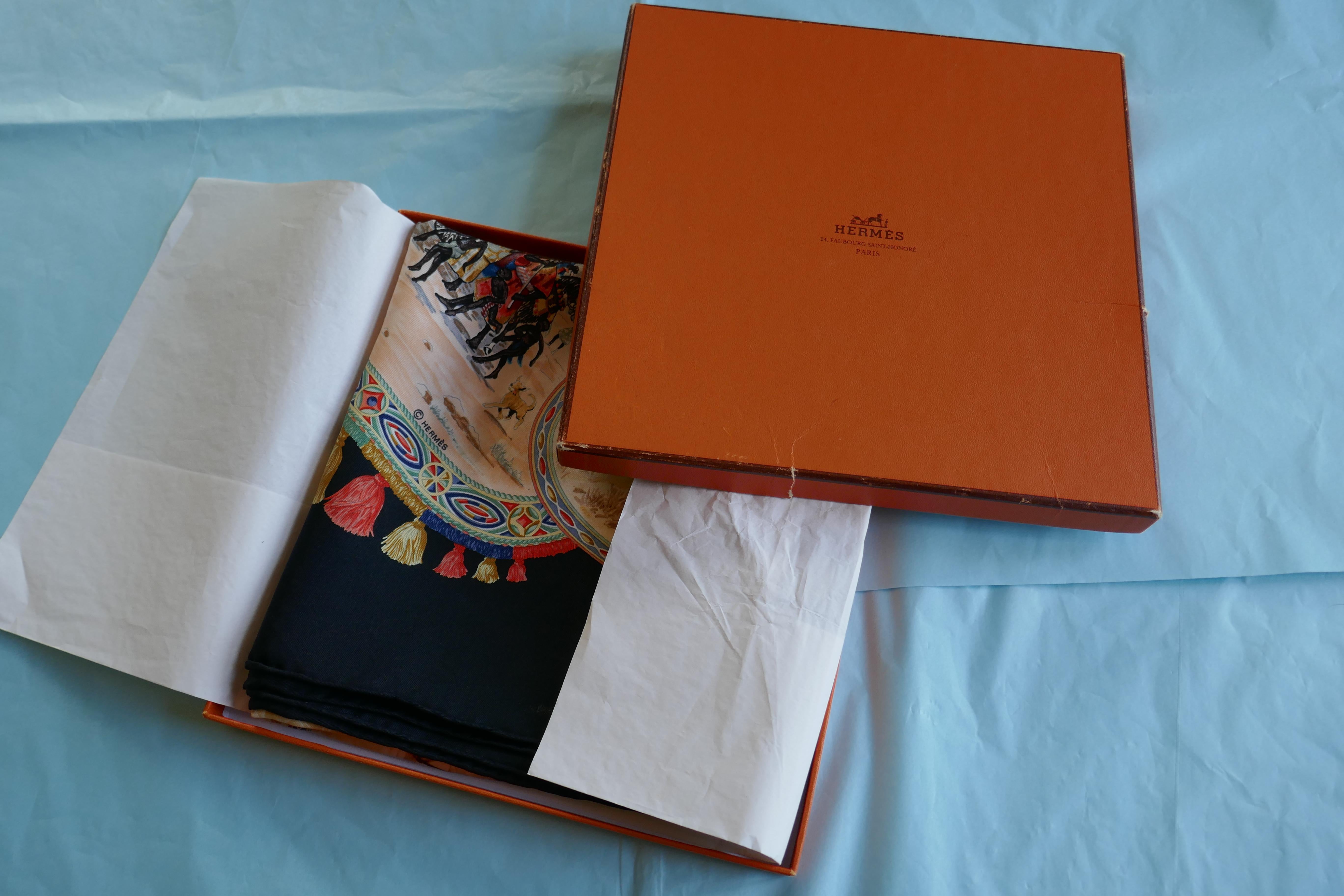 HERMÈS Silk Scarf, Jean de Fougerolle design “Chevalliers Peuls” in Black

In unworn condition, this scarf has been stored in folds for some years
Signature and the Hermes Logo hidden into the design byJean de Fougeroll
The scarf is in Black with