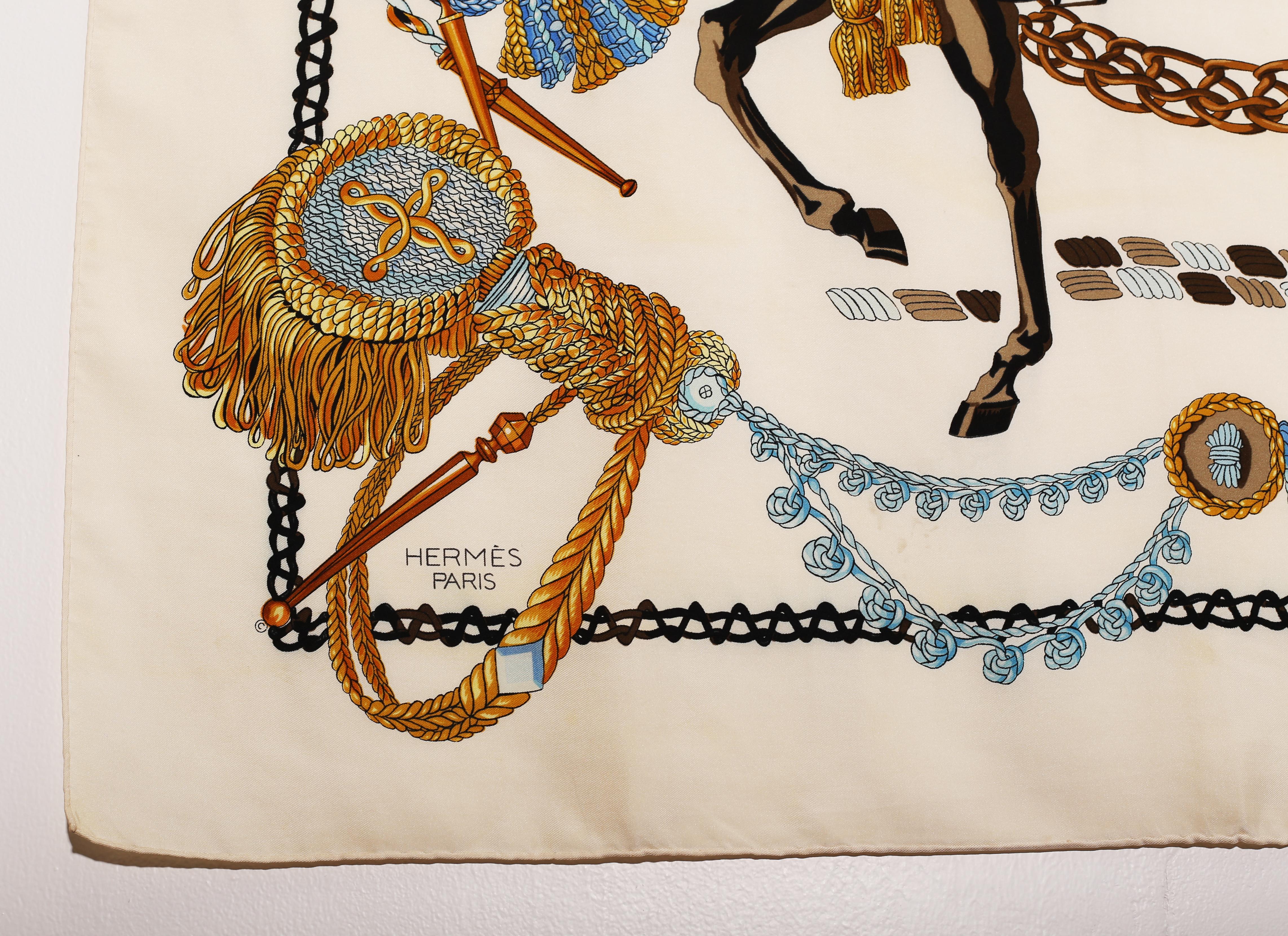 HERMES Scarf  Silk Scarf 100%  Paris, Made In France 
“Le Timbalier” first issued by Hermès in 1961. The design depicts a 'Timbalier,' or a timpanist, a mounted royal drummer riding his decorated mount playing his drums , all rendered in amazing