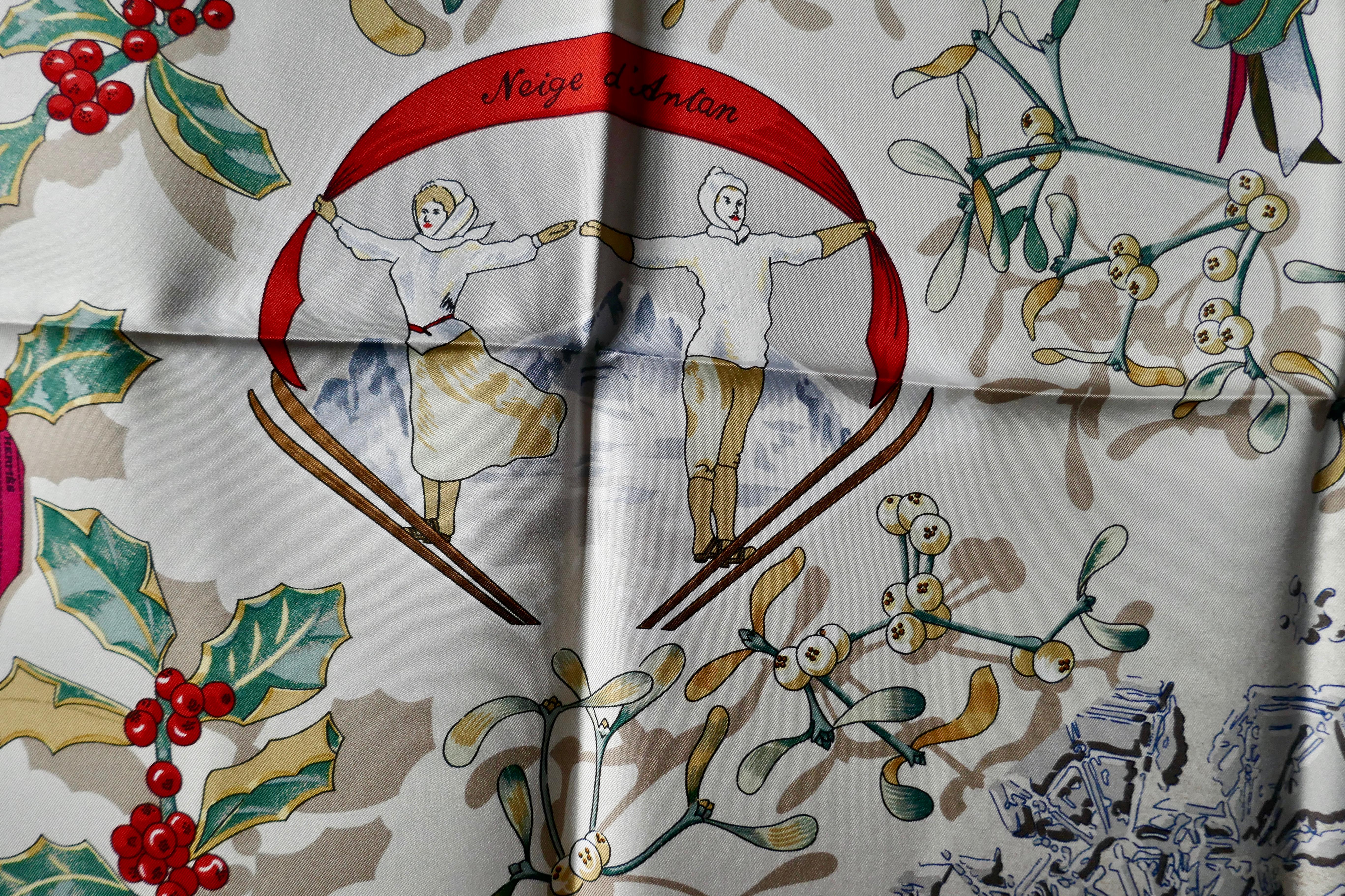 HERMÈS Silk Scarf “Niege d’Aantar” (Snow) designed by Caty Latham, 1989 

A snow scene from the past with Holly, Mistletoe and other winter plants, covered with snow, with very rare colorway, Black Border and very bright red and green foliage,