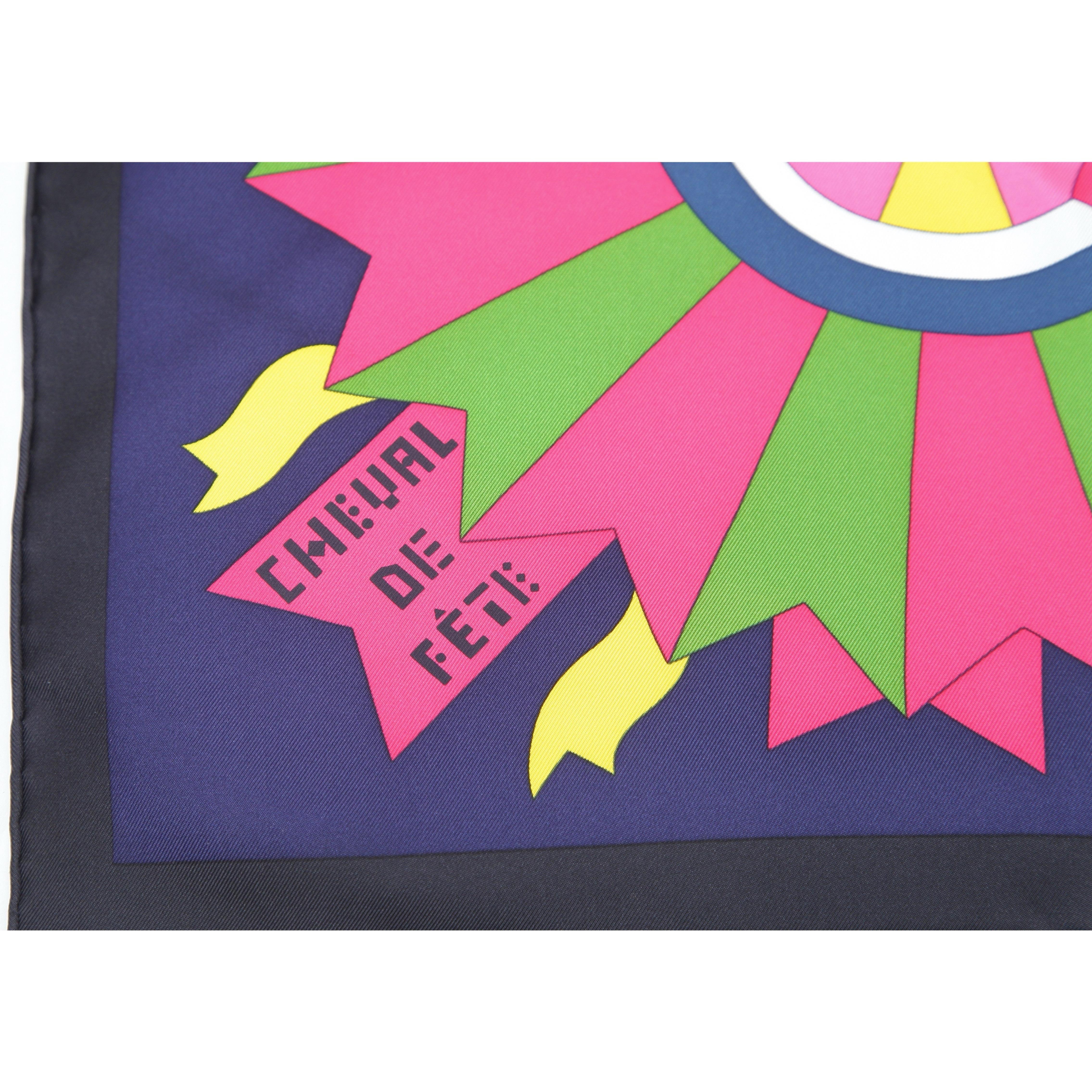GUARANTEED AUTHENTIC HERMES SILK SCARF CHEVAL DE FETE JAN BAJTLIK 90CM

Design:
- Rare Hermes silk print scarf, Cheval de Fete.
- Beautiful in multi colors against blue background.
- Square shaped.
- Hand rolled edges.
- Comes with Hermes box and