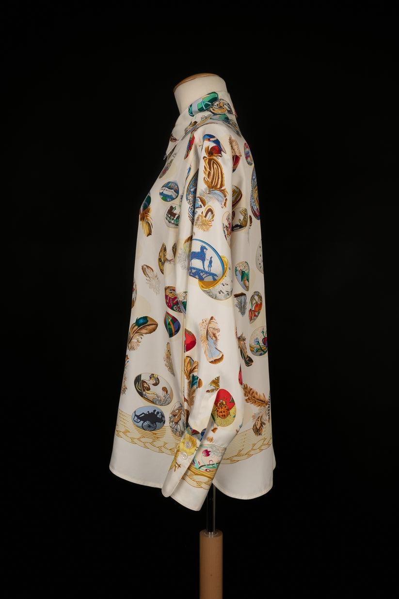 HERMÈS - (Made in France) Silk shirt with the 'Hermès' clutch' design by Caty Latham in 1994. Never reproduced. Size 38FR.

Additional information:
Condition: Very good condition
Dimensions: Shoulder width: 40 cm, Chest: 55 cm, Sleeve length: 60 cm,