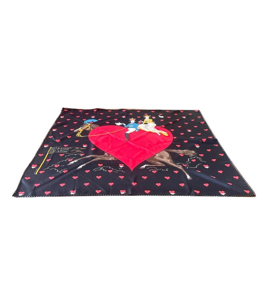 Hermes Silk Tea Time Medallion Scarf

Black with red love hearts and a fantasy ensues by Jonathan Burton.

'What a surprising way to celebrate tea time! A prince takes his belle on a poetic walk through a field of hearts – a love affair, no doubt.