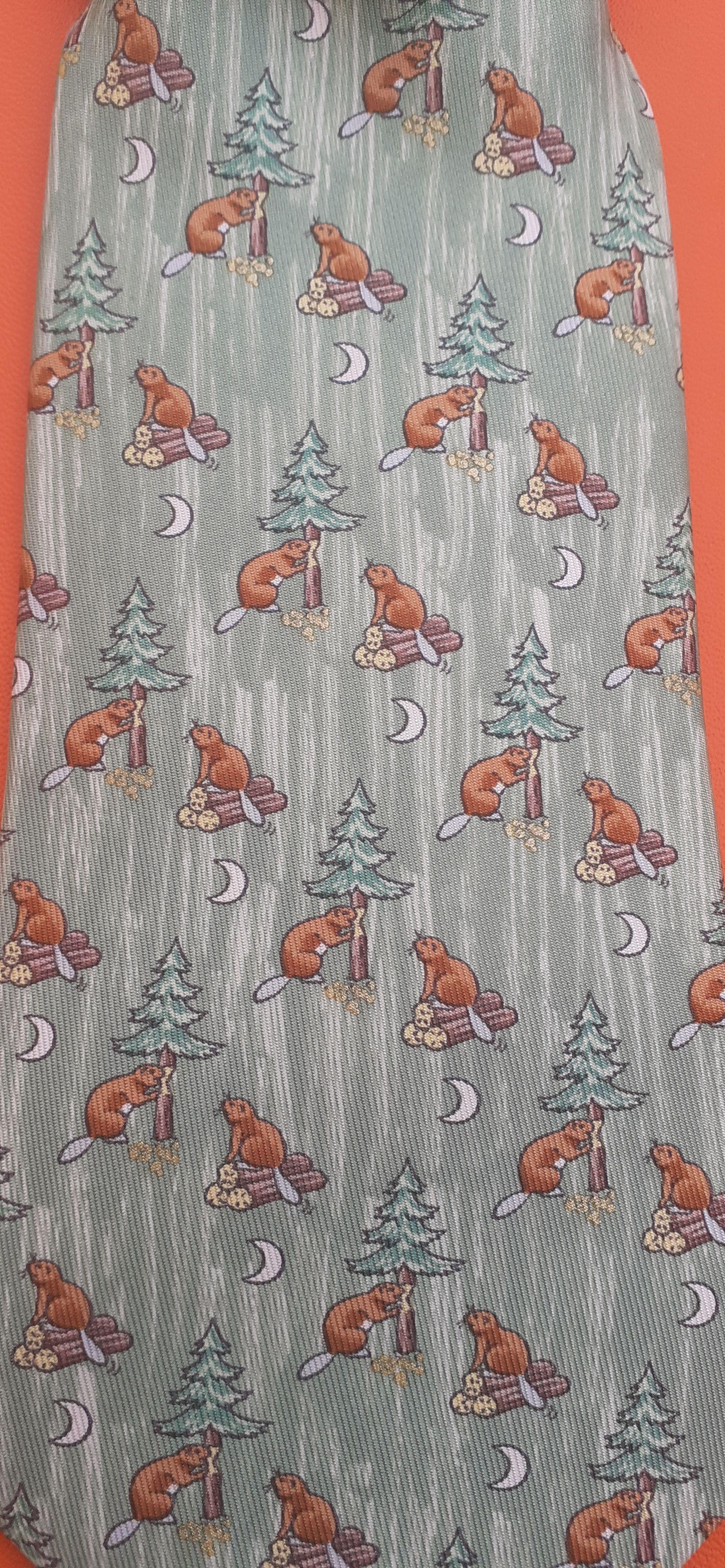 Beautiful Authentic Hermès Tie

Print: Beavers, Fir Trees and Moons

Made in France

Made of 100% Silk

Colorways: Green, Brown, Yellow, White

Please note: green is more vibrant in 