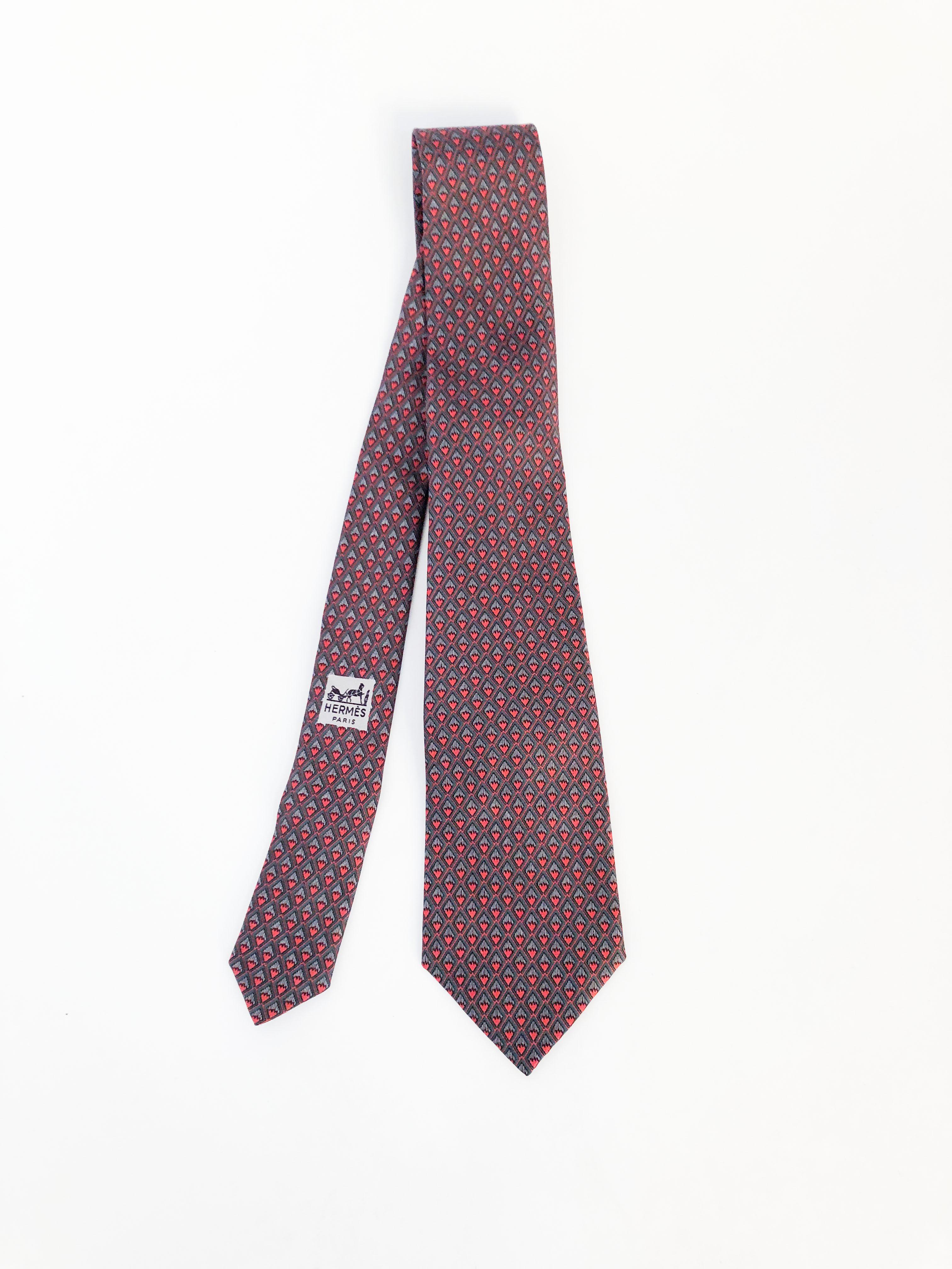 Hermès Silk Tie with Geometric Pattern featuring red, grey, green, and black diamonds pattern