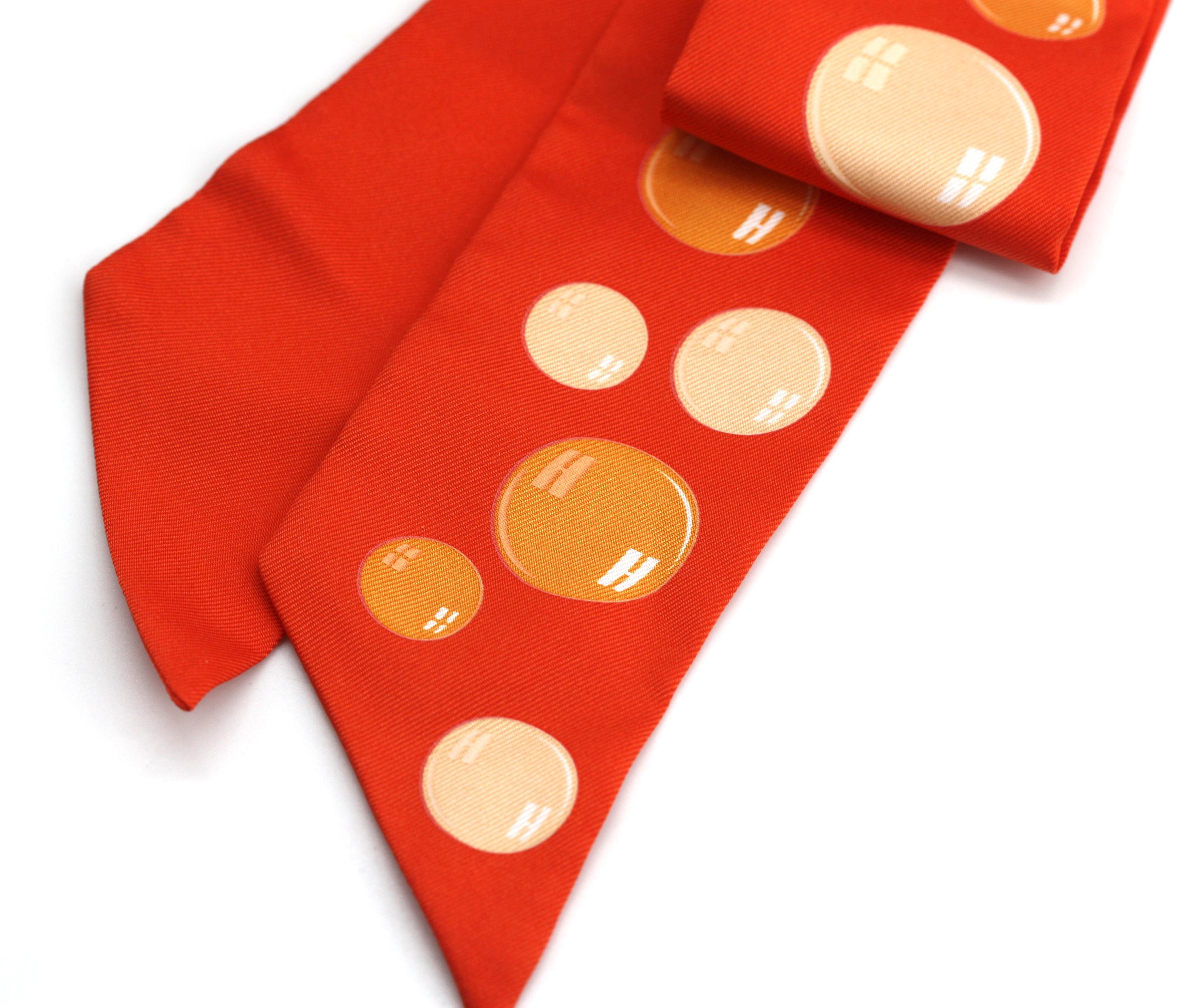 
Hermes Silk Twilly
Bubbles on an orange ground, in a cylindrical ribbon-tied carton.
Length 33 in.
Condition Report
Good condition