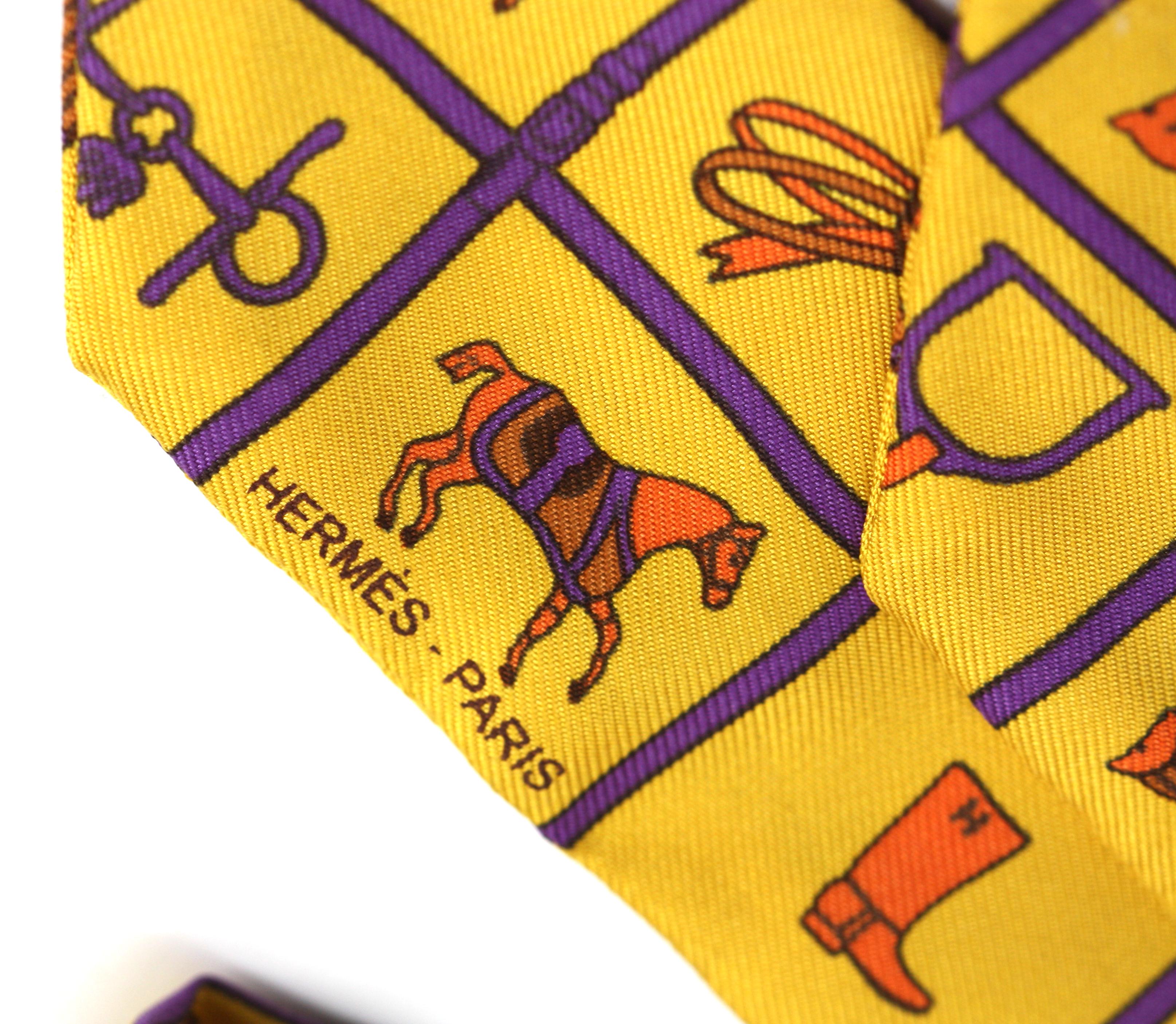 
Hermes Silk Twilly Scarf
Signed. Mustard squared with purple borders, each square with an equestrian motif, with ribbon-tied cylindrical carton.
Length 33 in.
Condition Report
Good condition.