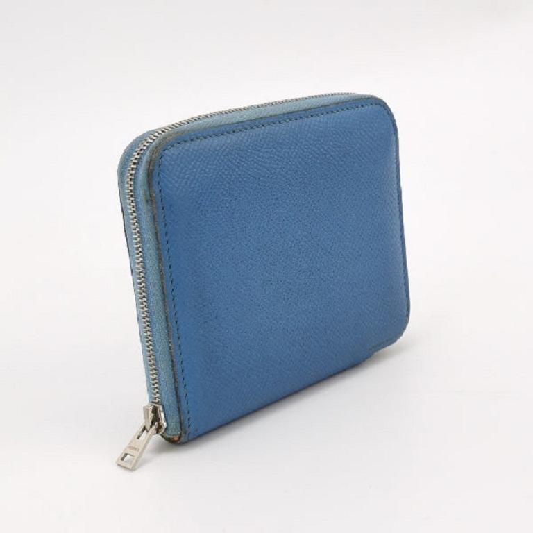 Hermes Silk'in Wallet Small Blue Leather These are professional photos of the actual bag offered by Luxbags. Expertly crafted by Hermes, the Silk'in Wallet in blue leather with silver hardware opens up to a luxurius silk interior. Boasting a classic