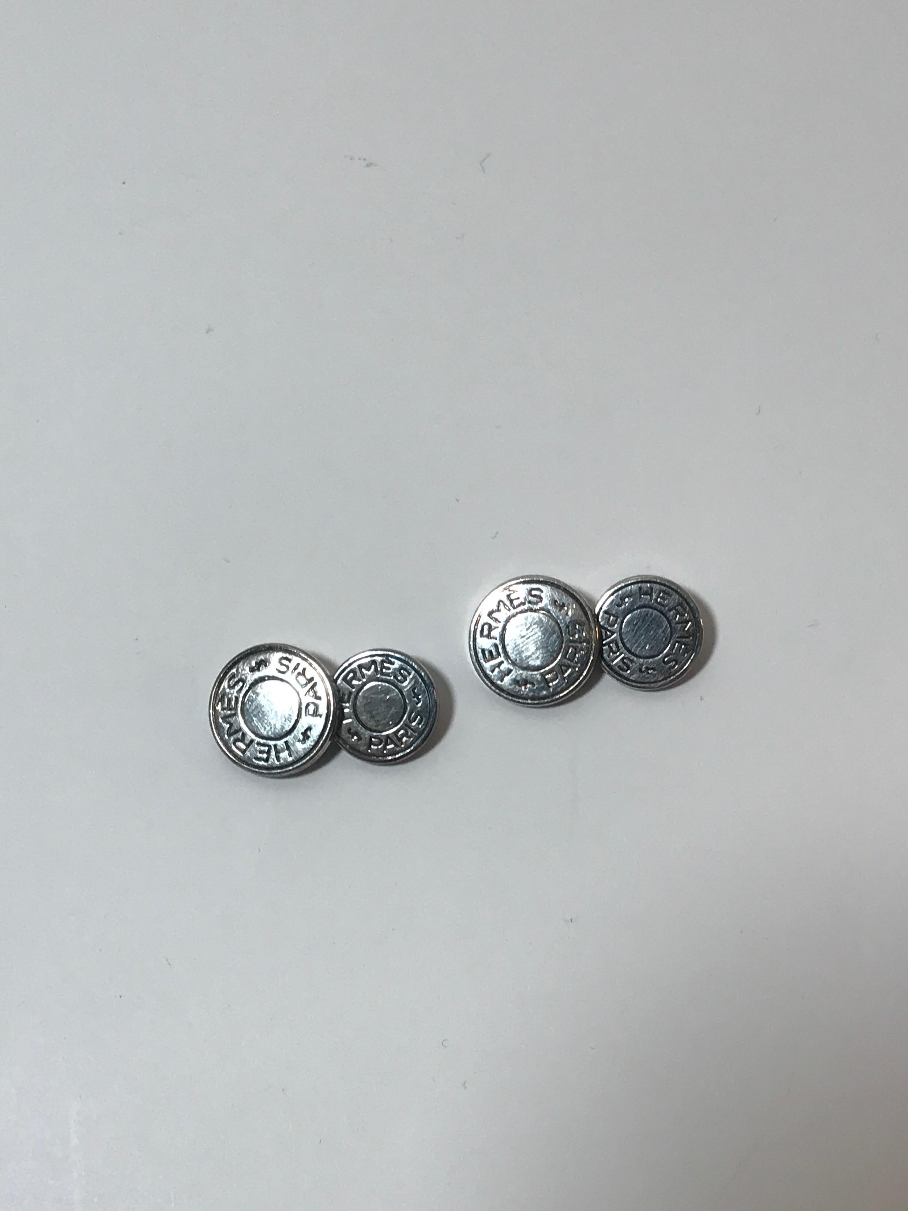 Pair of cufflinks in silver by Hermes. Model is named 