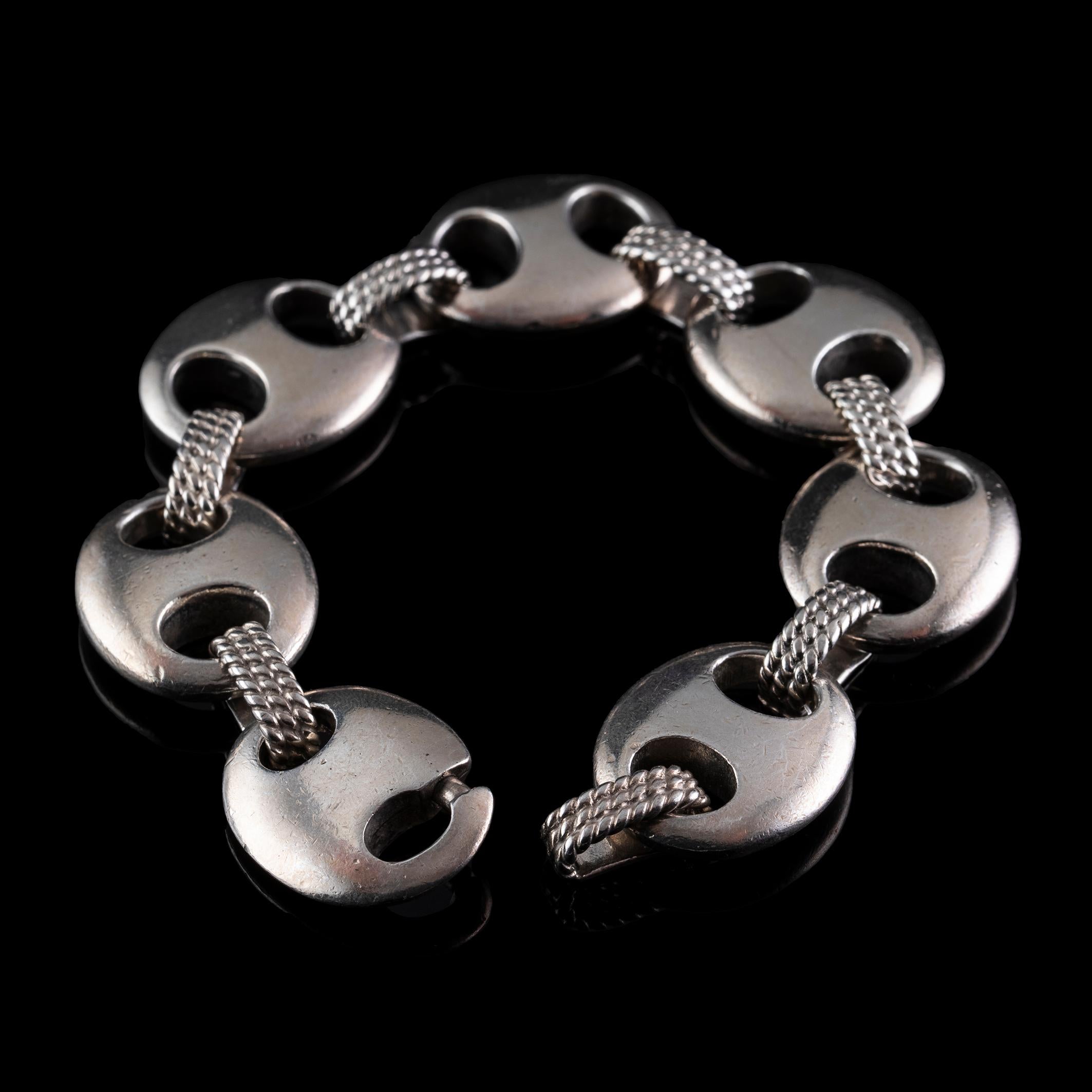 Experience the luxurious elegance of the Hermès Silver bracelet 