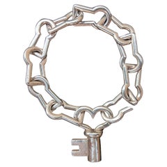 Hermès Pulsera de plata Eslabones en forma de ojo de cerradura Encanto de llave Cierre