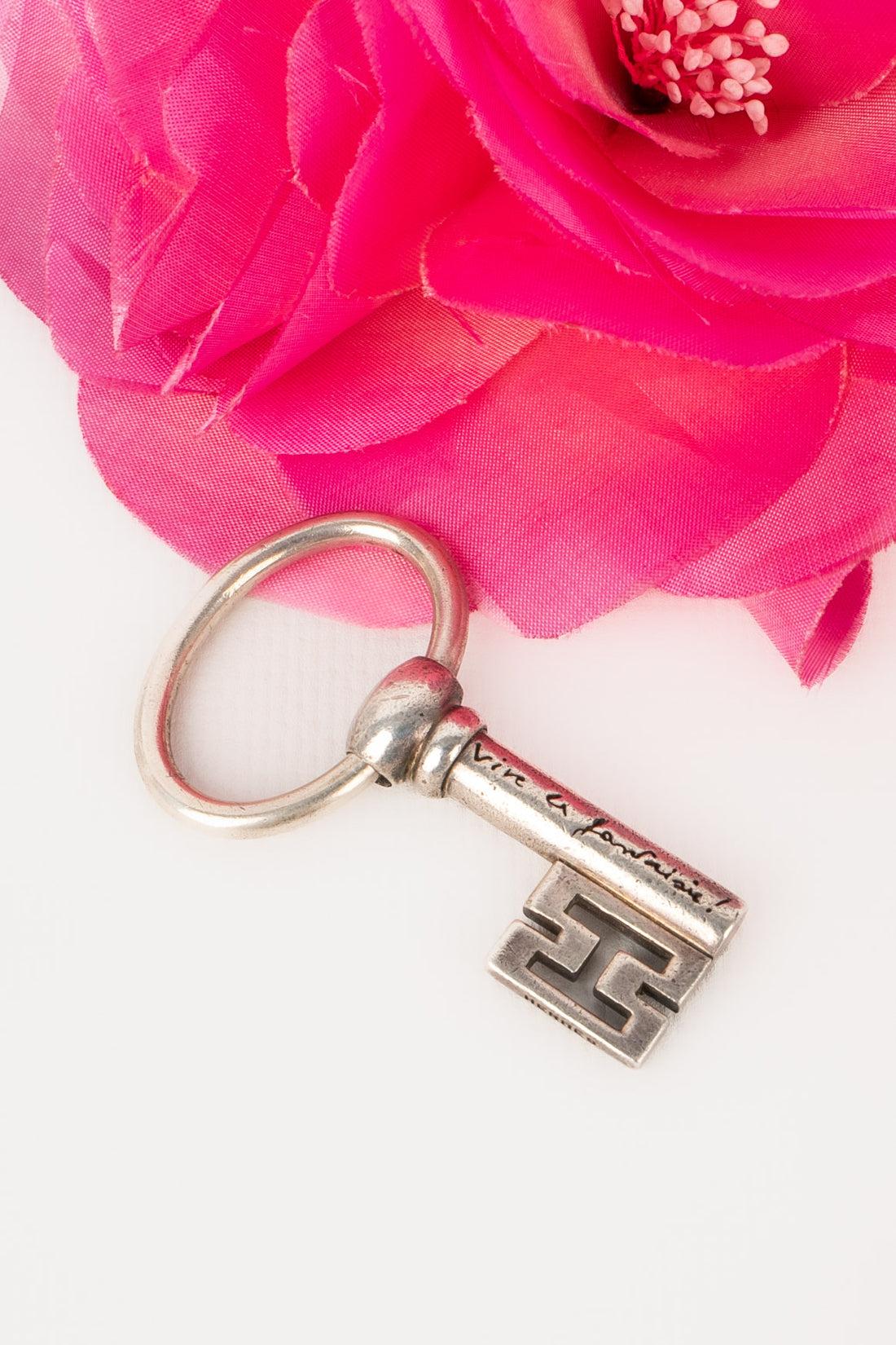 HERMÈS - (Made in France) Silver key ring representing a key pierced with the H. Produced in 2004 around the 
