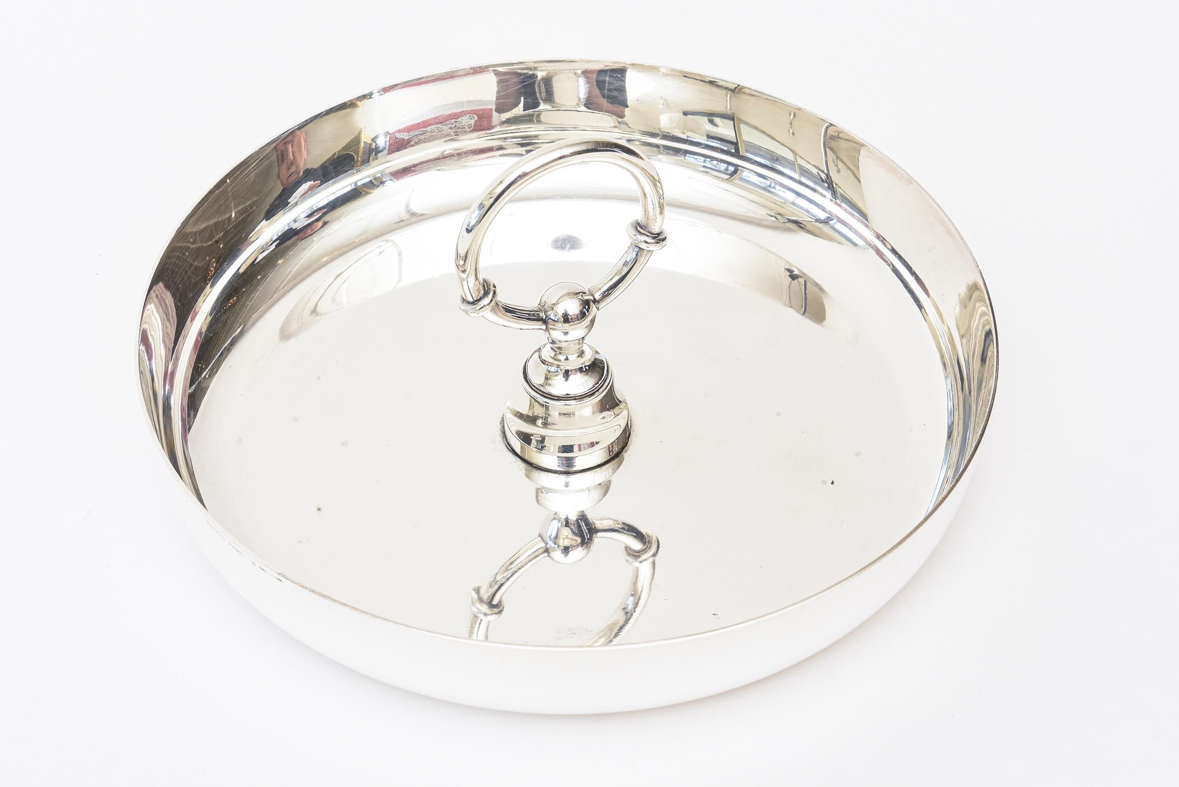 This amazing vintage Hermès rare silver plate double tray or bowl has the center of a rendition of the post that horses would have been bridled to. It is hallmarked Hermès Paris Made in France. This is the largest one seen that is vintage from the