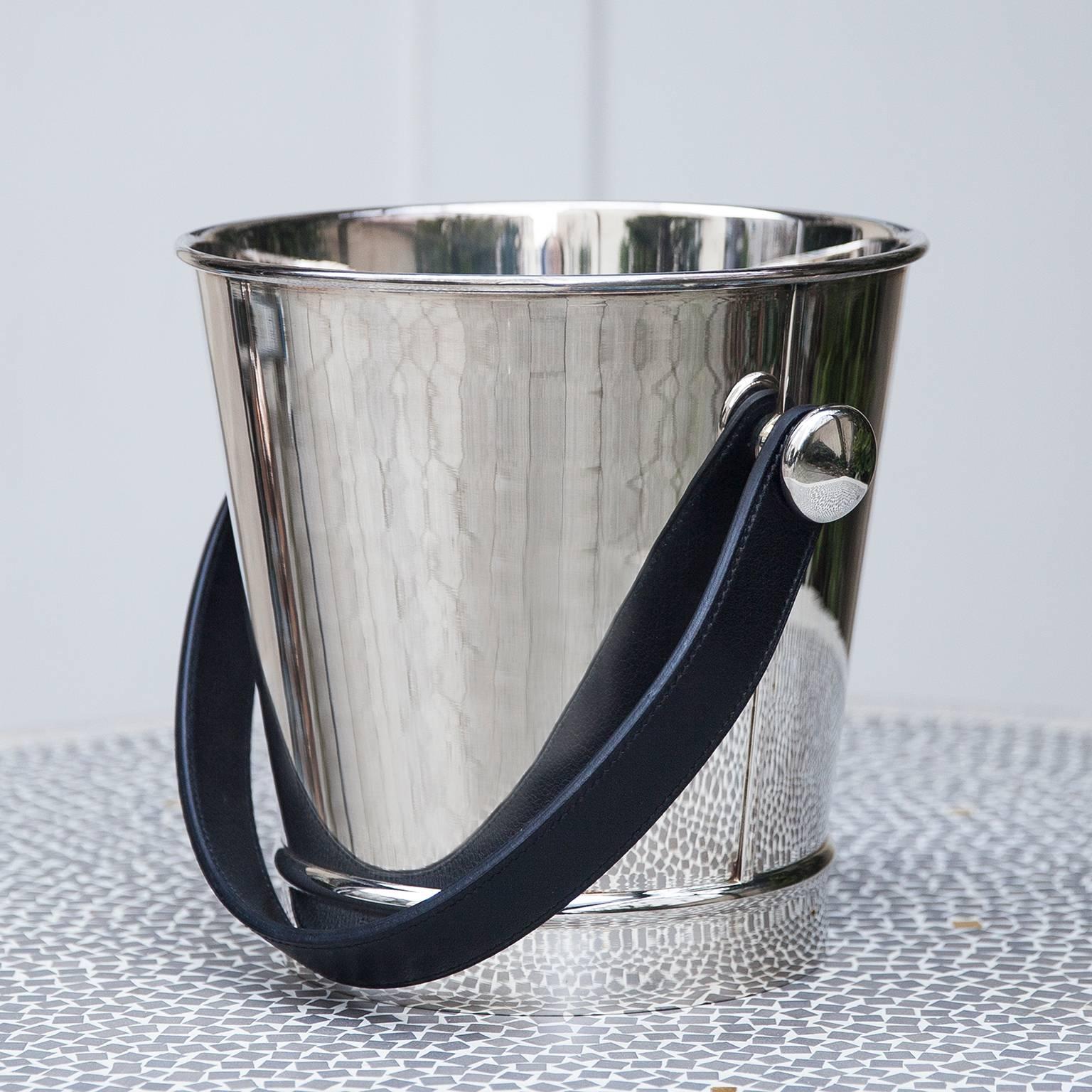 Hermes silver plated champagne wine cooler or ice bucket. This Amazing object speaks for its self. It was a custom order pieces with the hand-stitched leather handle.
Its the best of Hermes!