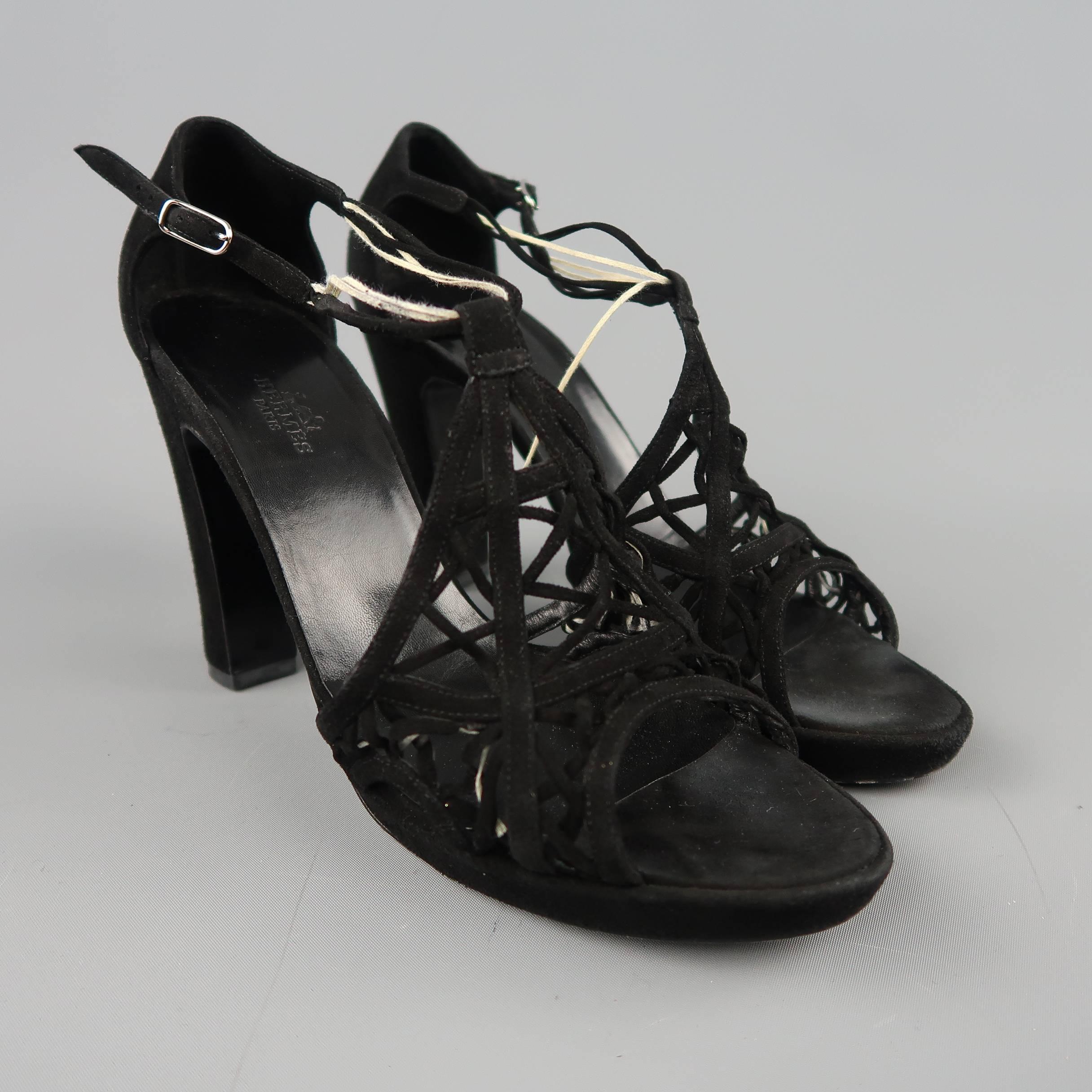 HERMES sandals come in black suede with an ornate woven front, ankle strap, and chunky heel. Wear throughout. As-is. Made in Italy.
 
Fair Pre-Owned Condition.
Marked: IT 40
 
Measurements:
 
Heel: 4.25 in.
Platform: 0.75 in.
