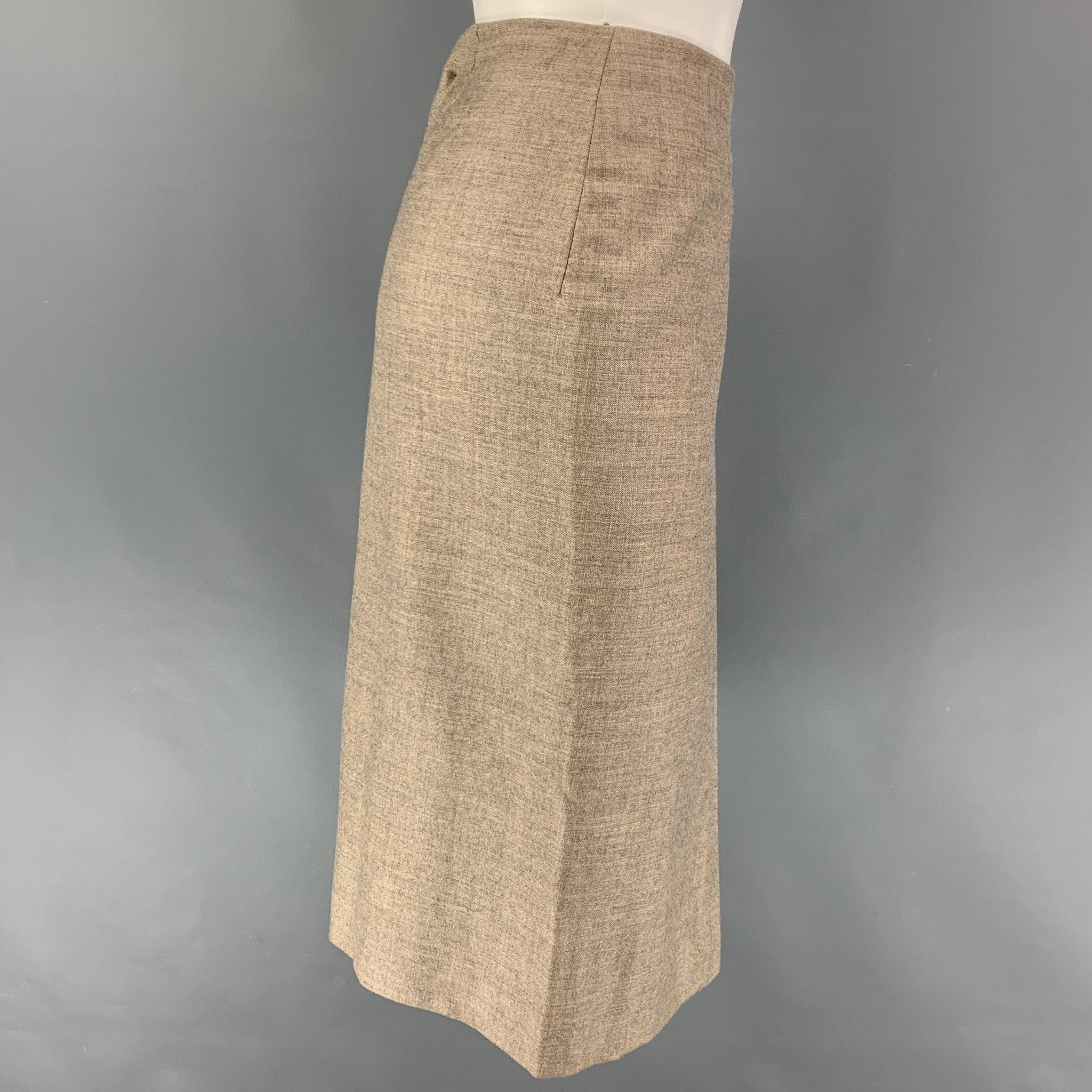 HERMES skirt comes in a taupe cashmere with a silk slip liner featuring an a-line design, front vent detail, and a back zip up closure. Made in France. Very Good
 Pre-Owned Condition. 
 

 Marked:  40 
 

 Measurements: 
  Waist: 28 inches Hip: 38