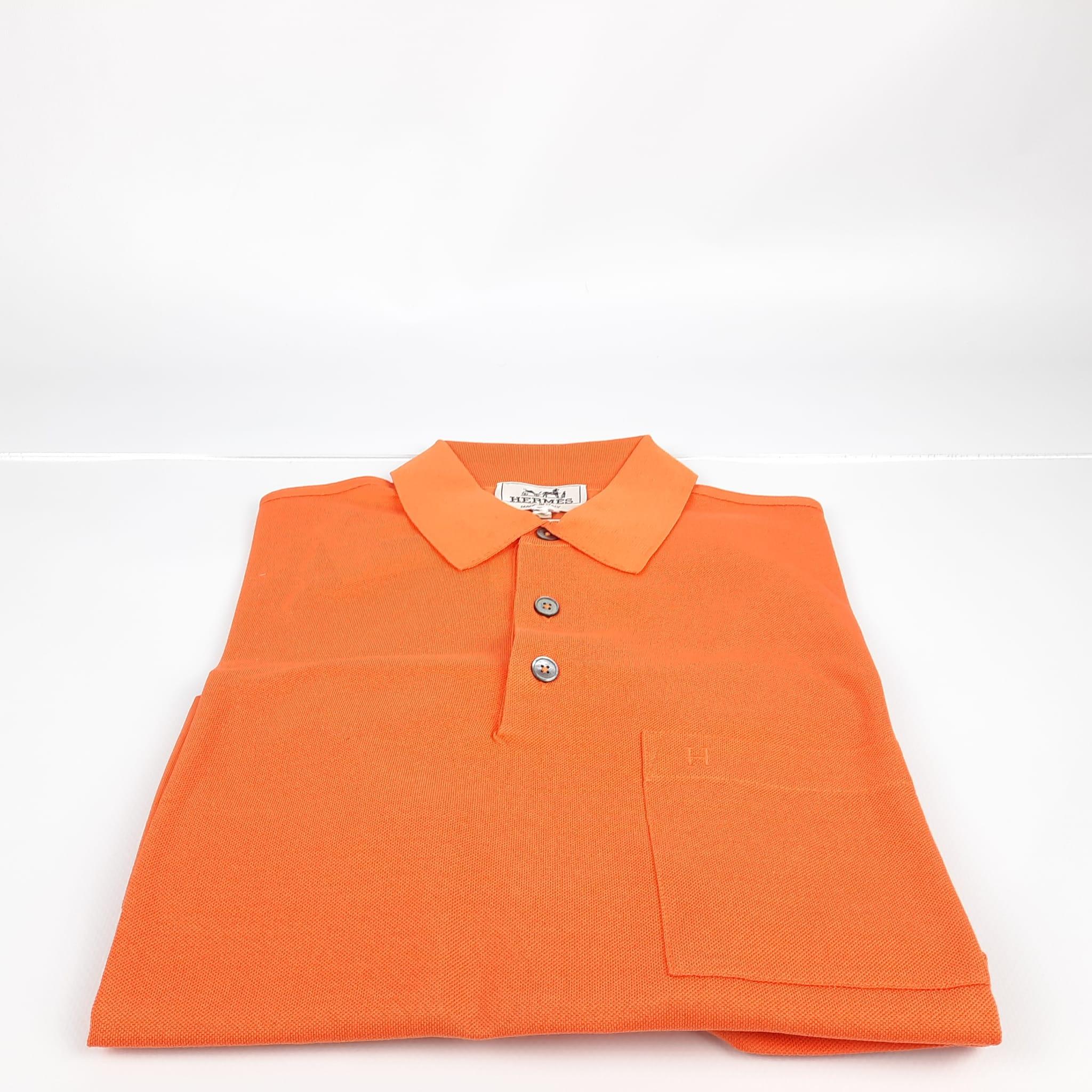 Size L. Short-sleeved buttoned polo shirt with H embroidery, in cotton pique, chest pocket.