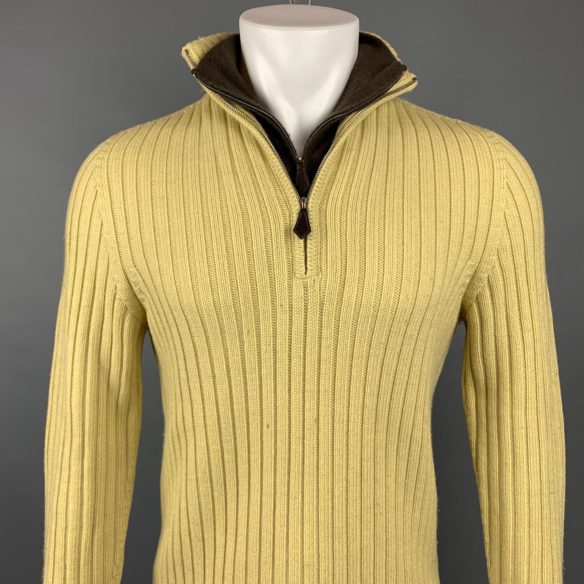 HERMES sweater comes in a yellow knit wool / cashmere featuring a double collar design and a half zip up closure. Italy.

Good Pre-Owned Condition. Moderate pilling throughout.
Marked: L

Measurements:

Shoulder: 16.5 in.
Chest: 40 in.
Sleeve: 28