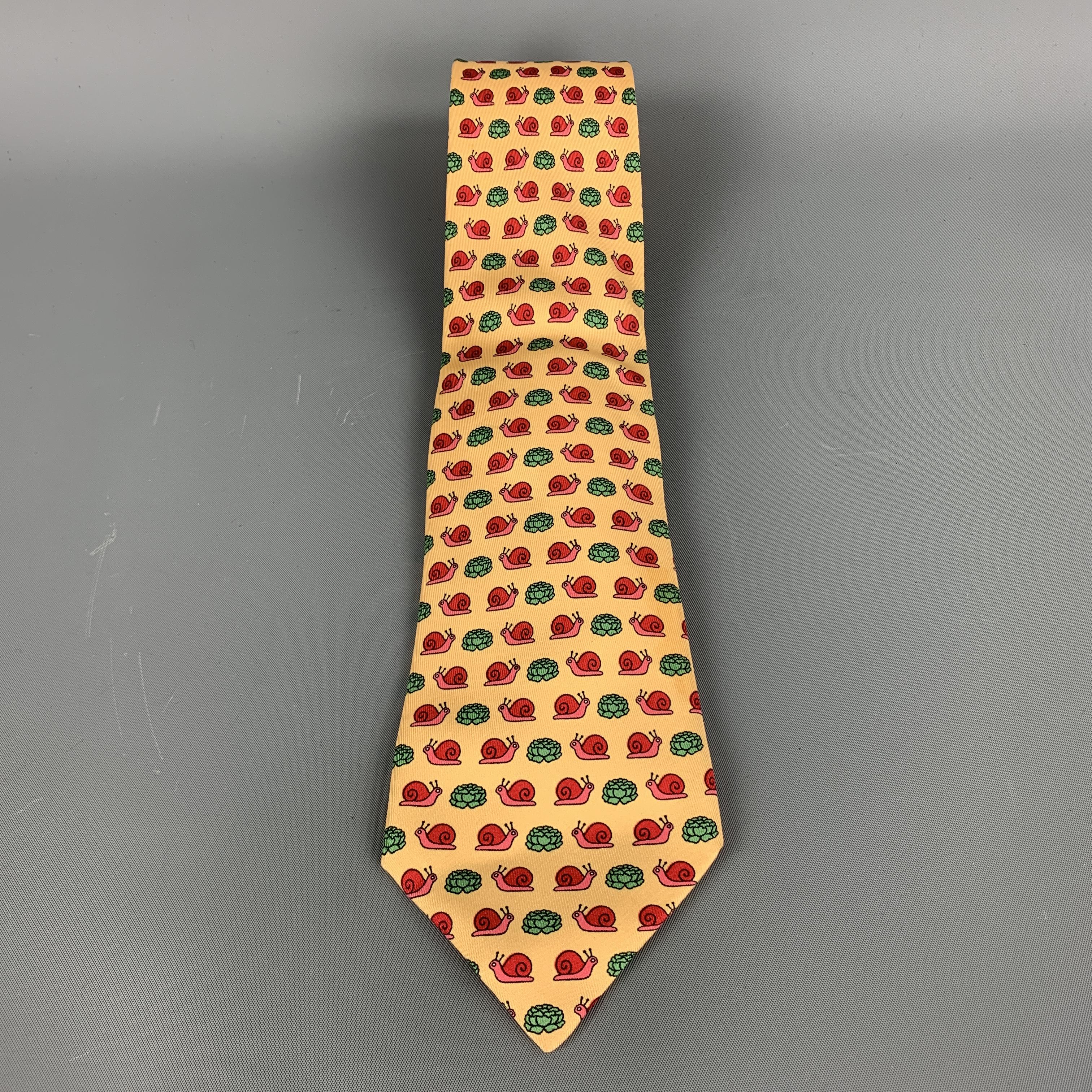 Vintage Hermes necktie comes in yellow and white silk twill with all over 