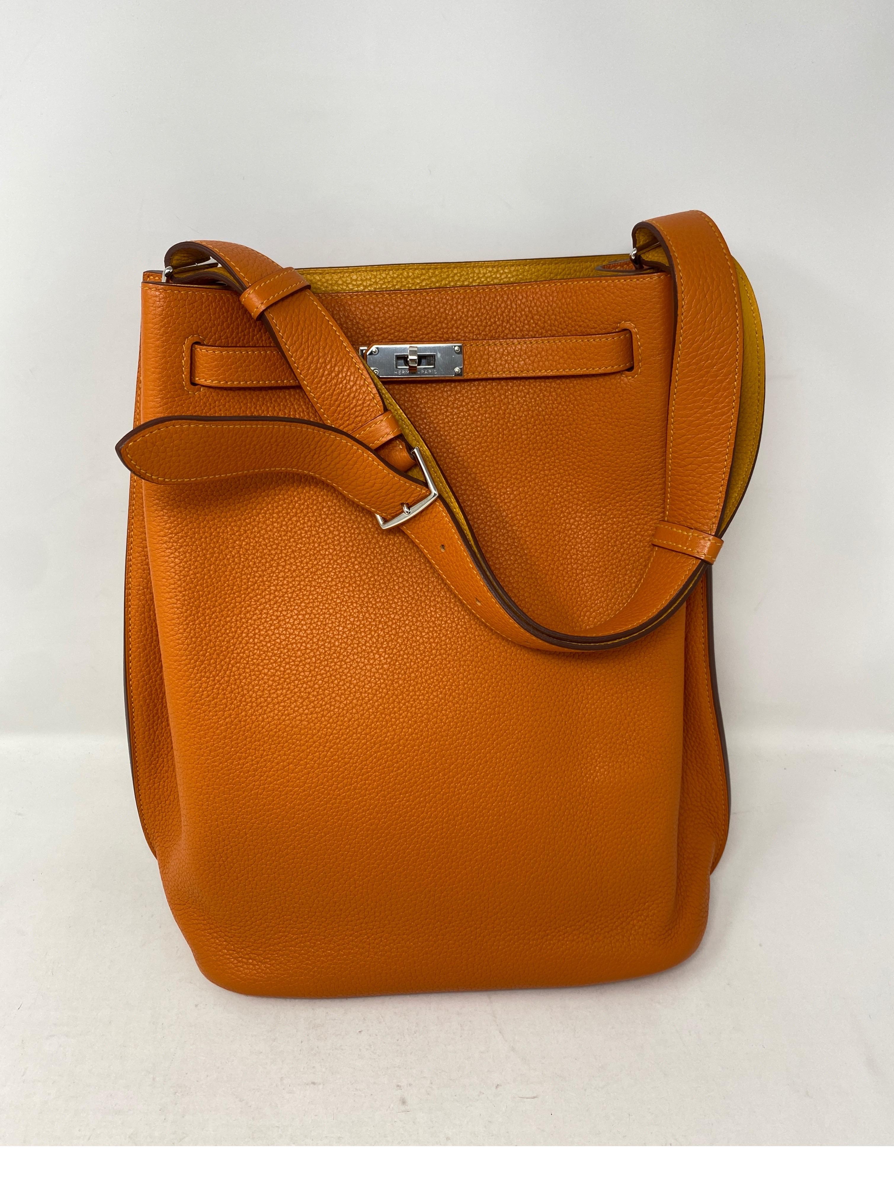 Hermes So Kelly Orange Candy Bag. Orange exterior and yellow interior leather. Palladium hardware. Excellent like new condition. Gorgeous bag. Iconic Hermes Orange color. Clemence leather. Guaranteed authentic. 