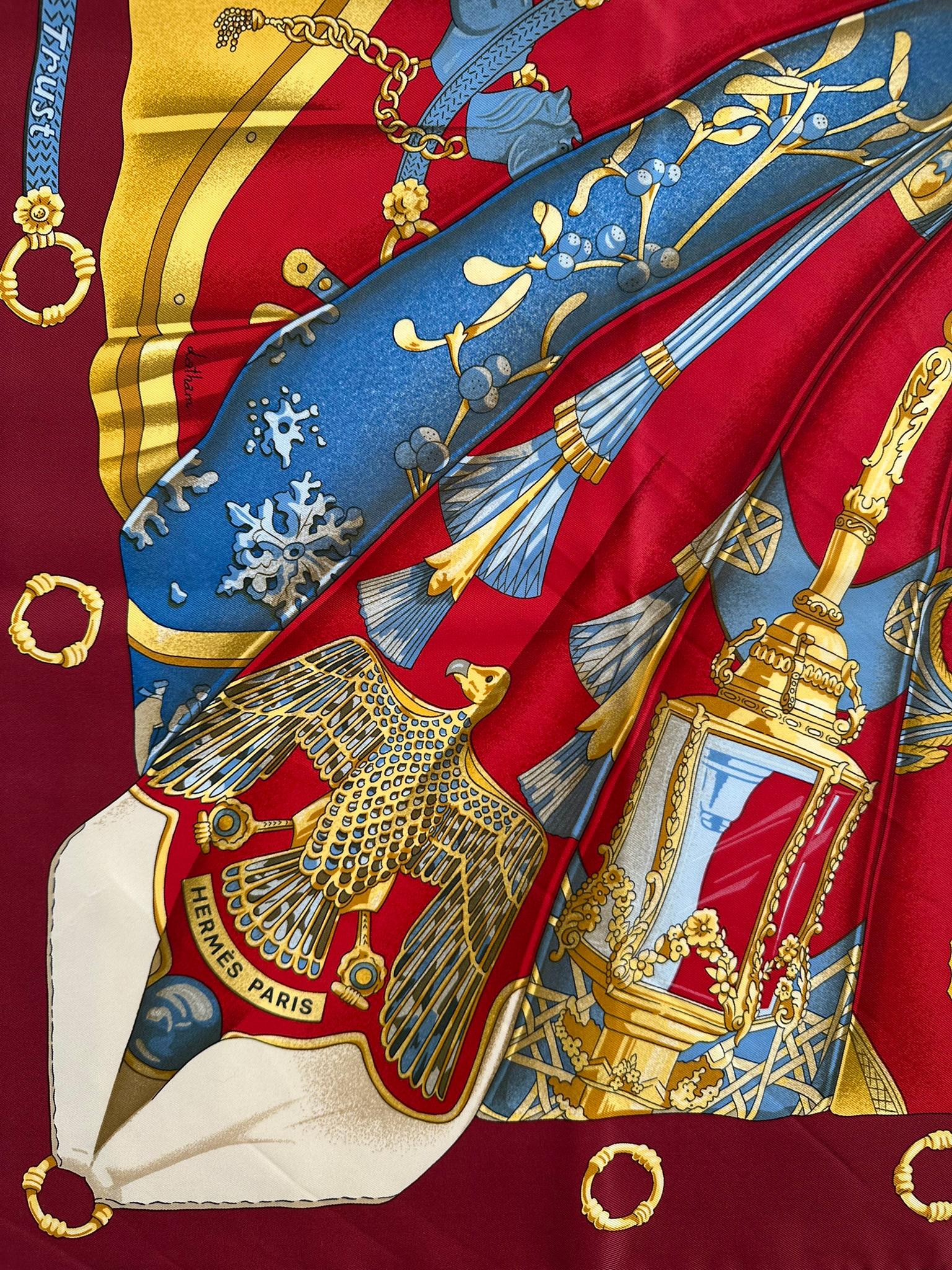 Designed Cathy Latham and first issued in 1995, Soleil de Soie, sun silk, is a sunburst of samplings from 20 of Latham's famous designs, over the years, for Hermes. At the center of the scarf is an ivory white bow, the scarf is done in rich