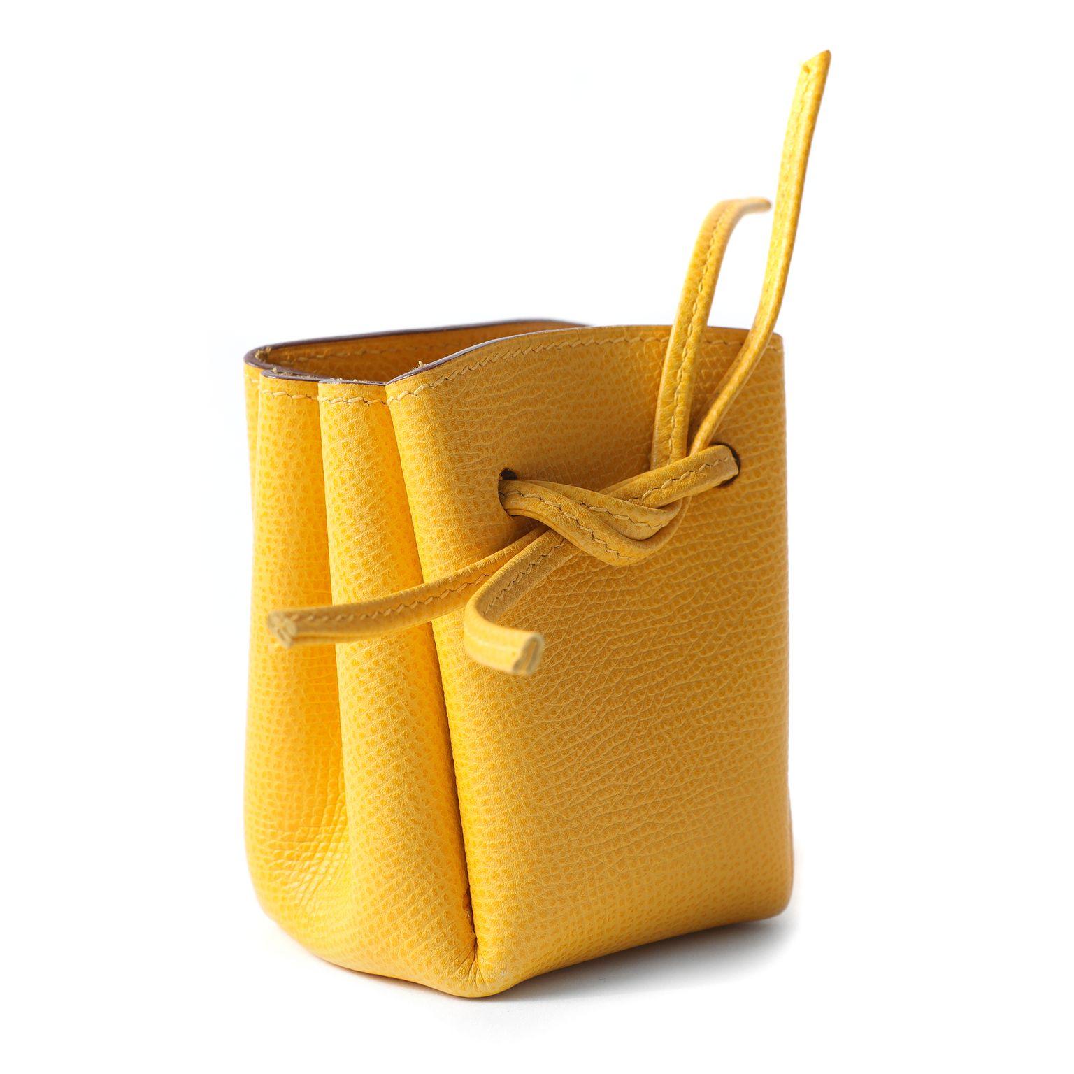 This authentic Hermès Soufre Yellow Epsom Vespa Pouch is in pristine condition.  Adorably dangles from a bag or tossed inside, this cheerful little accessory is a great gift.  Made in France. 

Measurements:  3.5” x 3.75” x 2.25” 

PBF 12353