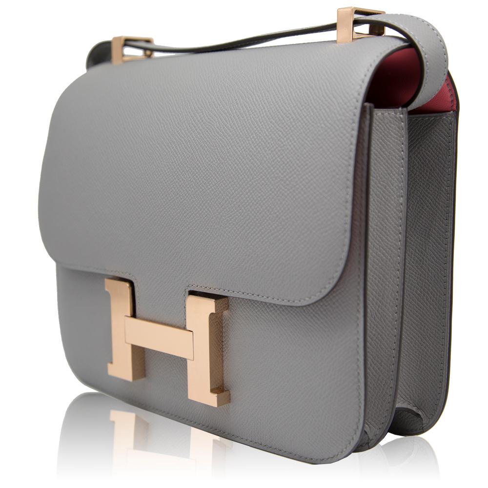 Sleek, subtle and sophisticated, this unique 24cm Bi-colour Constance bag from Hermès was specially made to order, meaning it is the only one of its kind displaying such an intricate design and features a Gris Asphalut Veau Epsom leather- a favoured