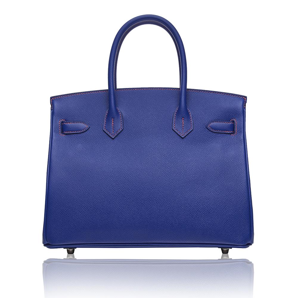 Adding a twist to the traditional Hermès Birkin, this truly spectacular, one-of-a-kind rarity combines an Electric Blue Epsom leather exterior with contrasting Rose Jaipur stitching and silver-tone metal accents, for an effect that is unexpectedly