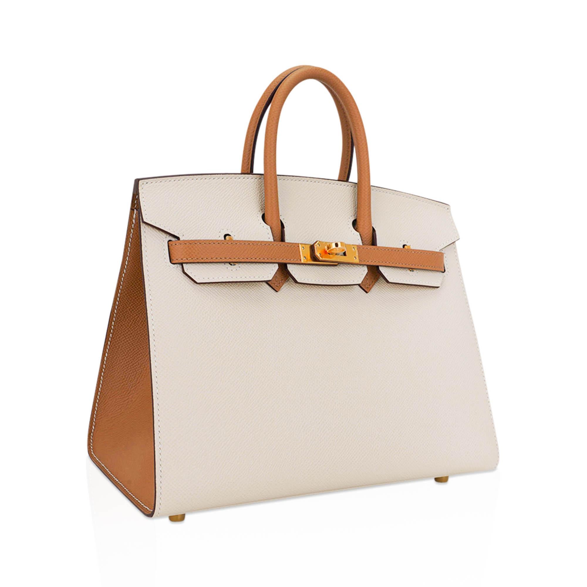 Mightychic offers an Hermes Birkin Sellier 25 HSS bag featured in Craie and Sesame.
This special order Hermes Birkin is a perfect compliment of neutral colours for year round wear.
Lush with Gold hardware.
This exquisite bag is modern and