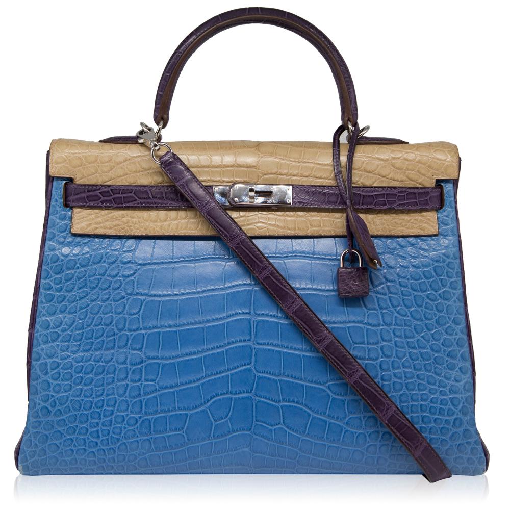 This Special Order 35cm Tri-colour Kelly bag from Hermès is a true testament to the quality of the house's craftsmanship, exuding timeless style and elegance. Crafted from rare leather, a favoured Hermès hide for its large, square, rougher ridged