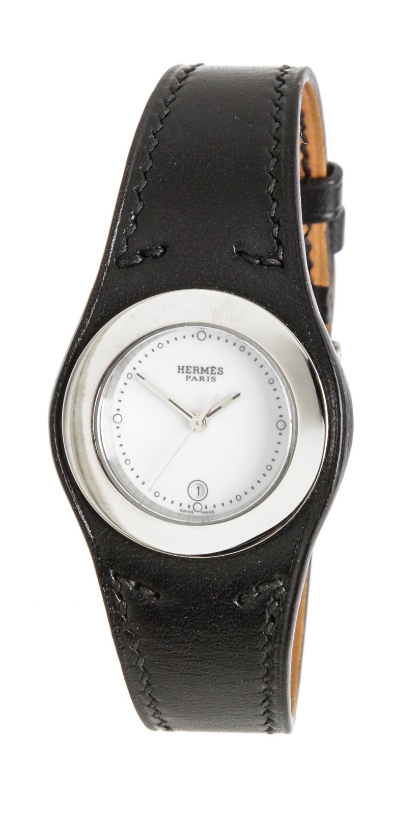 Stainless steel 30mm Hermès Harnais watch featuring a quartz movement, smooth bezel, white dial and black leather strap with tang buckle. The fit of this watch can be made larger or smaller by adjusting the buckle.

16330MSC