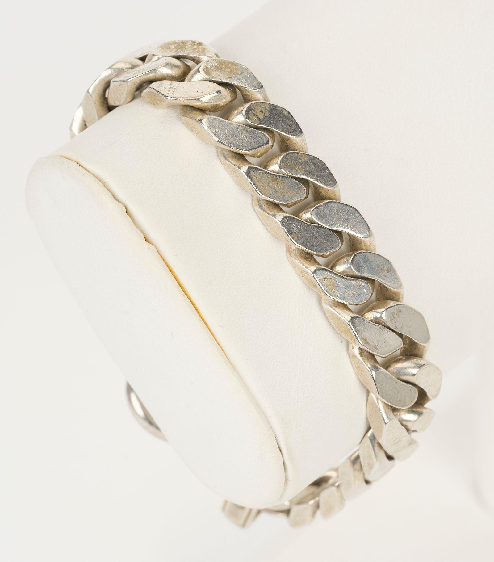 Bold and powerful, this vintage Hermès large link sterling silver buckle bracelet is utterly striking.  Signed Hermès.  Circa 1980-90.  Adjustable length from 7 1/2