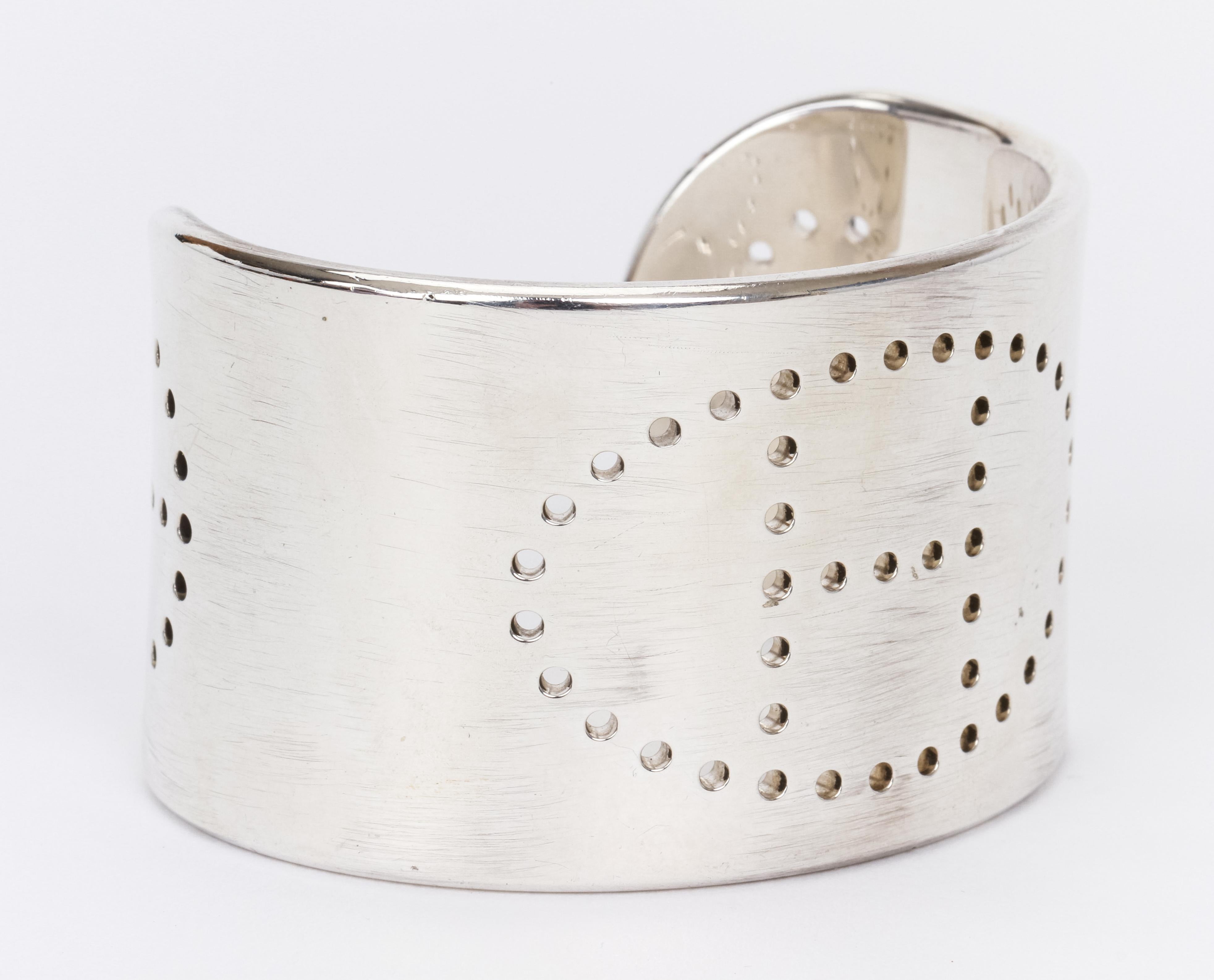 Hermes Sterling Silver 925 H bracelet with perforated logo and motifs on both ends. Generous amount of precious metal.