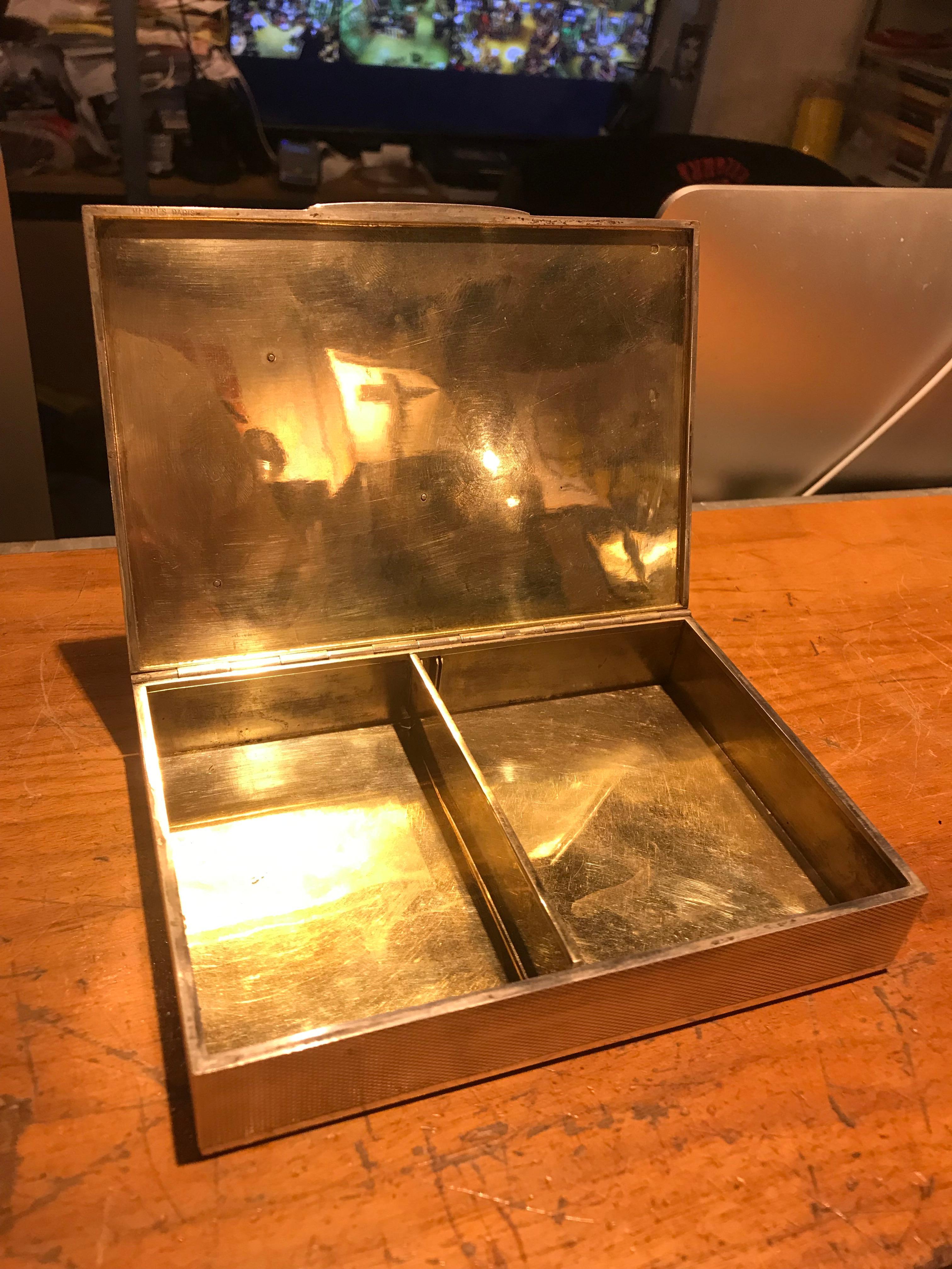 A fine and rare example of a sterling Hermes desk object. Complete with their anchor motif and incredible engine turned texture, this box would be perfect for any coffee table or desk. Fantastic condition and look for its age.