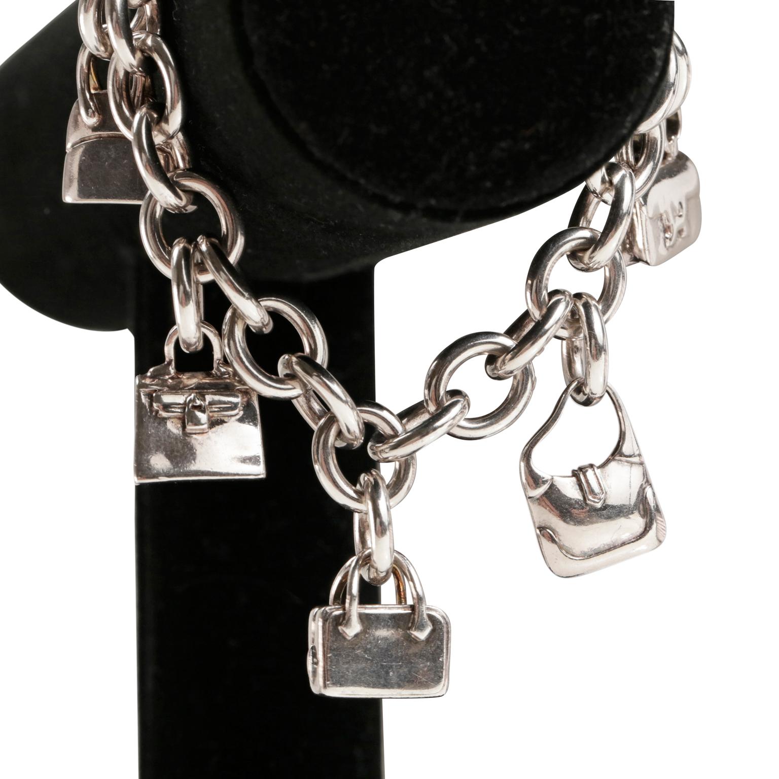 Hermès Sterling Silver Charm Bracelet- Excellent Condition
Adorned with five iconic Hermès bag charms, this is a wonderful piece for any collection. 
Sterling silver link chain with toggle closure.  Five iconic bag charms include a Constance, Kelly,