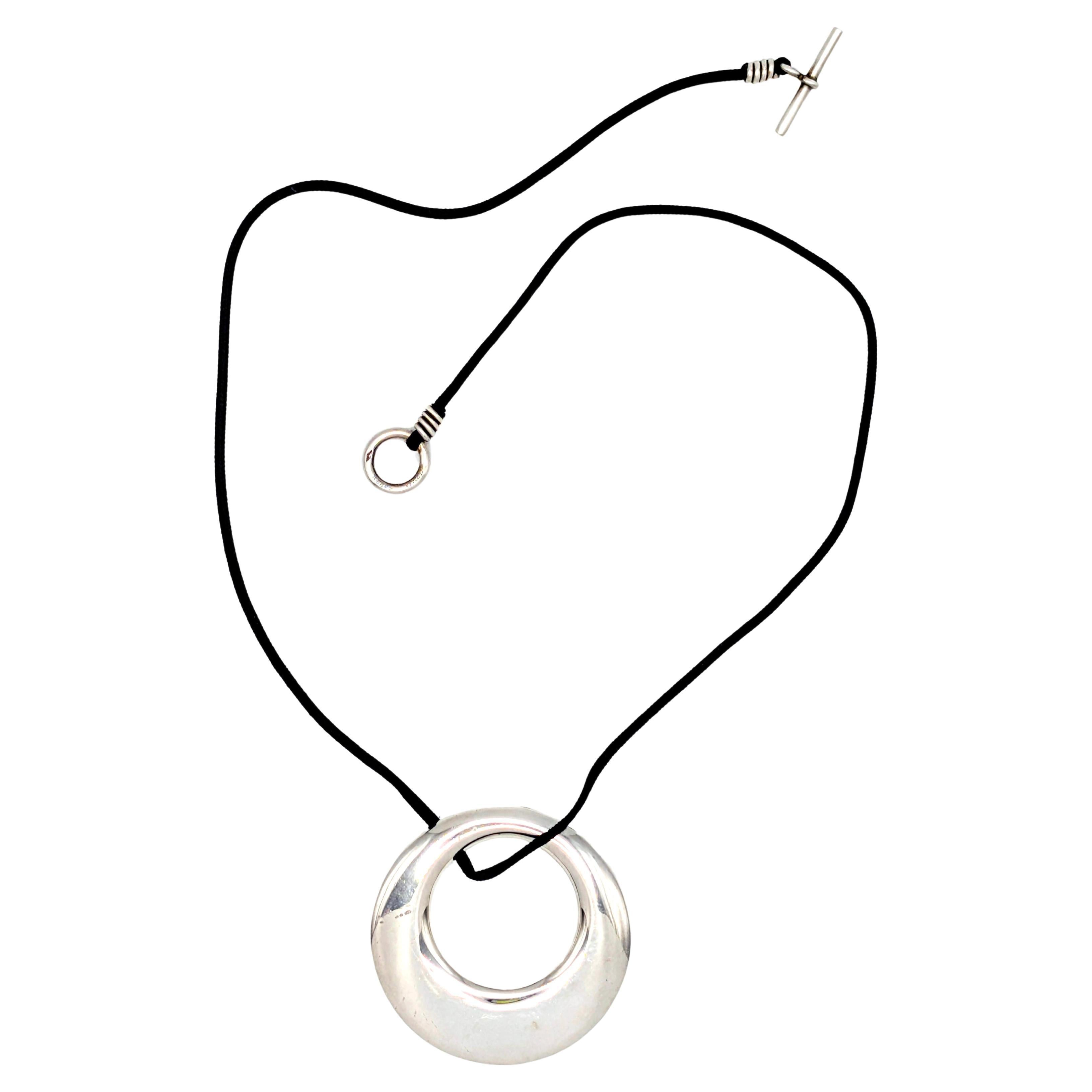 Hermès Sterling Silver Circular Pendant Black Cord Necklace For Sale