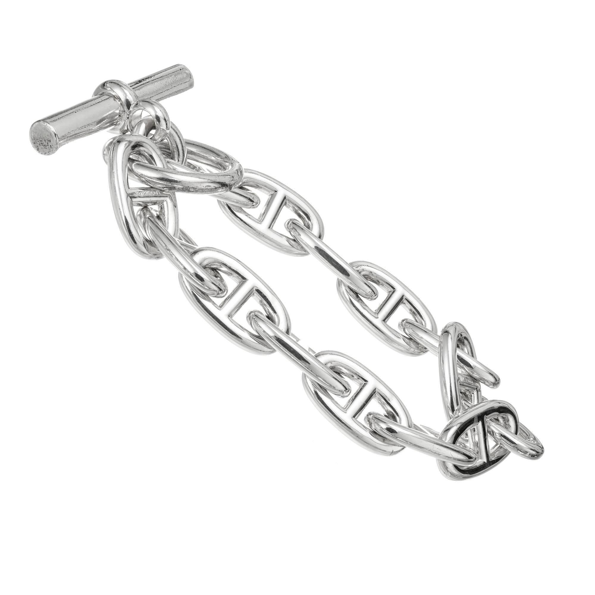 Hermes D'ancre silver toggle link bracelet. 8 Inches in length. Large size. 

Sterling Silver
Stamped: AG 925
Hallmark: Hermes 
72.6 grams
Bracelet: 8 Inches
Width: 11.4mm
Thickness/depth: 3.0mm
