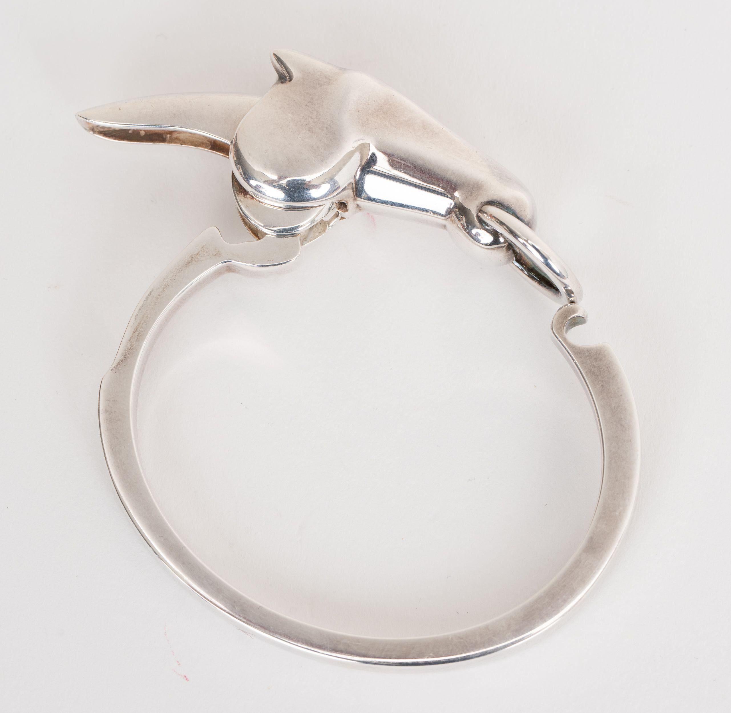 Hermes Sterling Silver Galop Bracelet features a simple silhouette along side the horse head motif in the center. Size small. Comes with original high jewelry box.