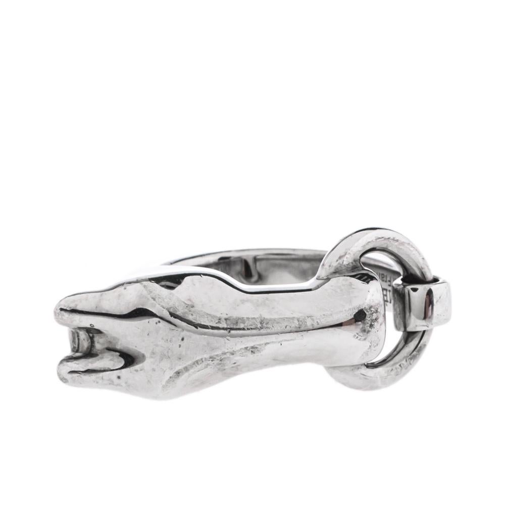 This bold and stylish ring from Hermès is ideal for women who like donning a punk look. Crafted from silver, it is designed in a simple silhouette with an edgy horsehead motif at the centre. The vintage finish and fine detailing make the creation an