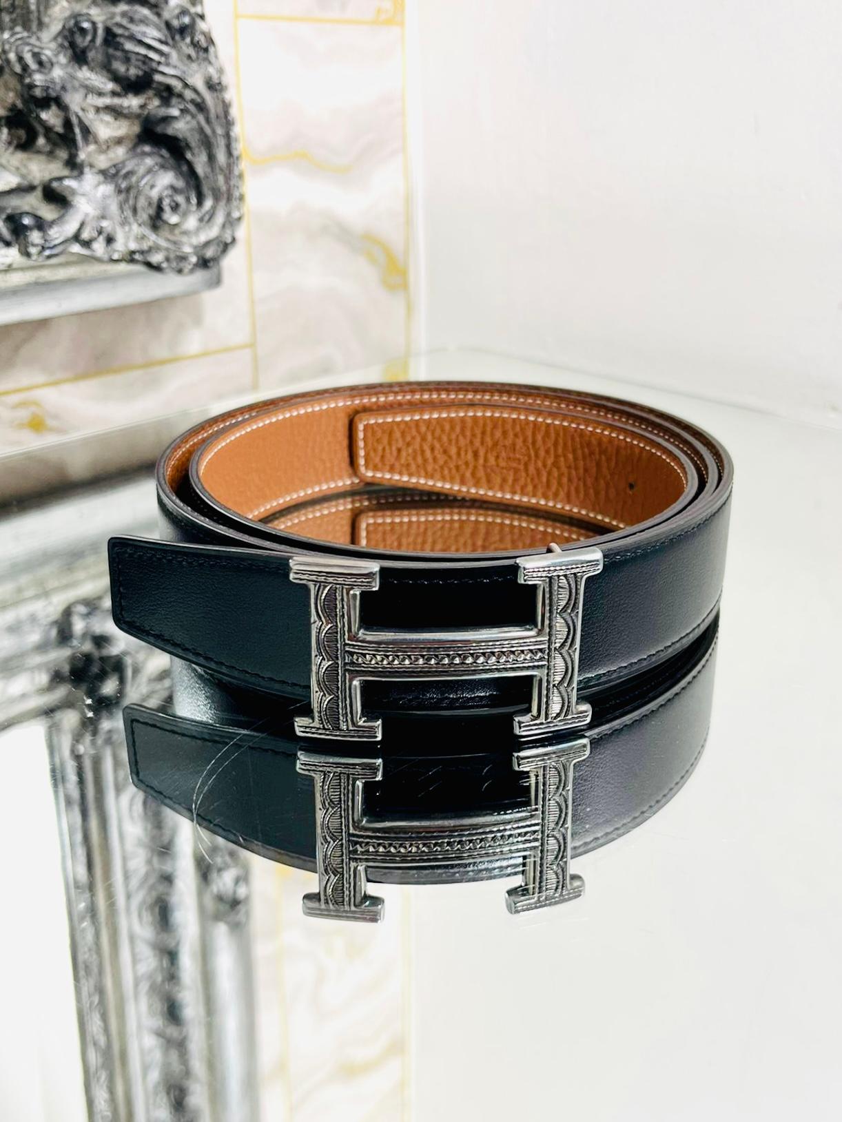 Brand New - Hermes Sterling Silver Touareg Buckle & Leather Belt Set

Solid 925 silver, blackened, engraved buckle with black and 

brown, reversible leather belt.

The Toureg collection each buckle is intricately, hand carved with designed by