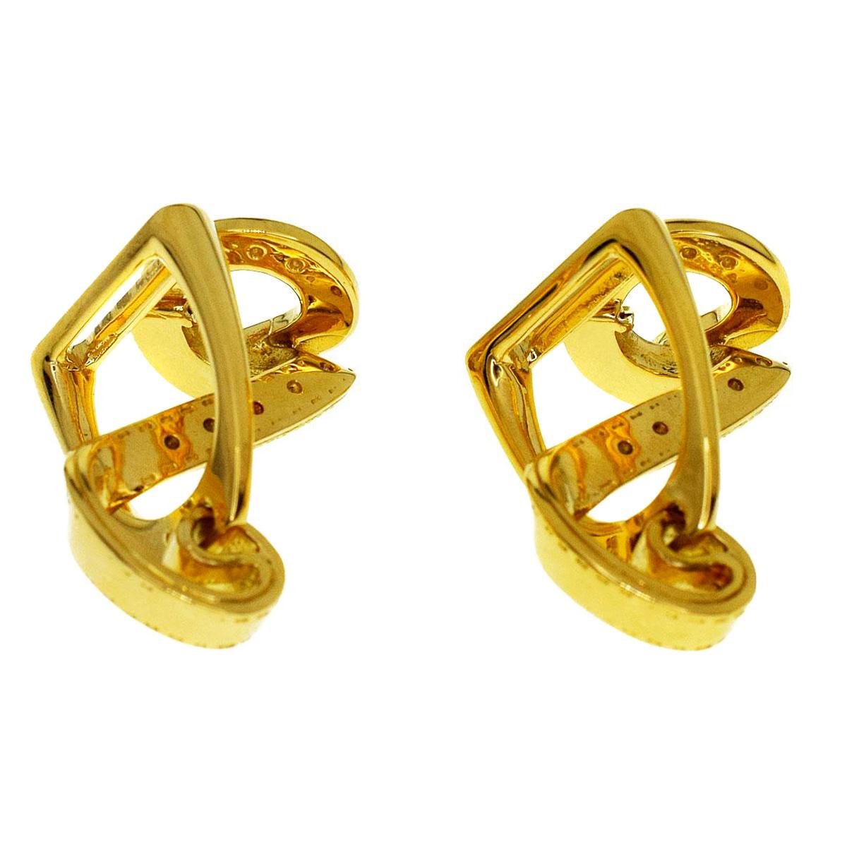 A magnificent set of Hermes cuff links featuring the iconic Stirrup motif in 18k yellow gold.