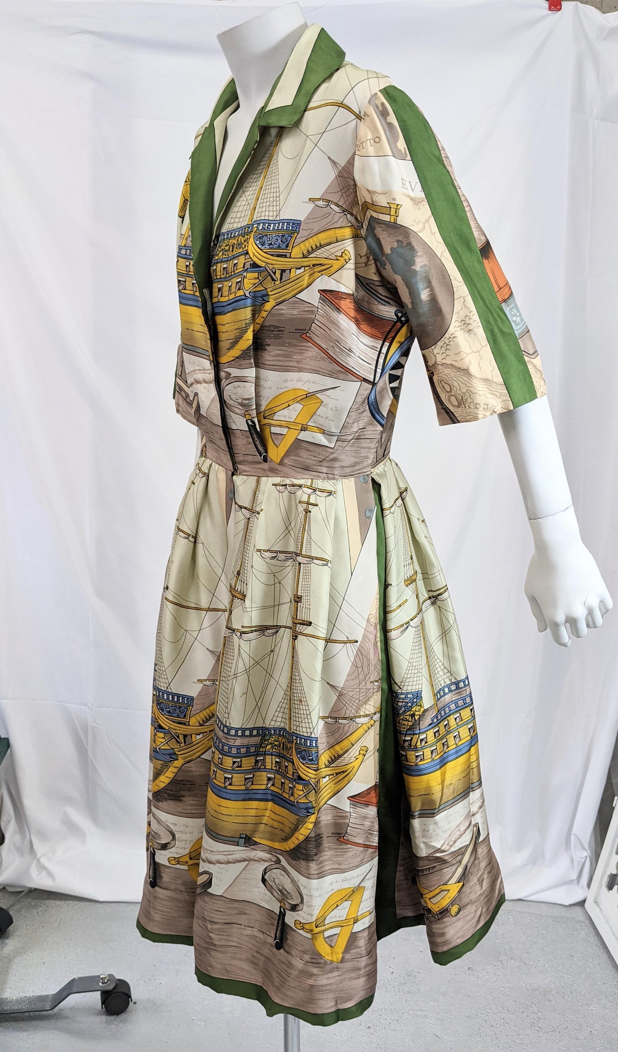 Hermes inspired nautical themed silk twill shirtwaist dress. The Hermes style amusing silk scarf print of clipper ships in blues, browns, gold and greens. Skirt organza lined to create fullness with deep pleats at sides and center back. Covered