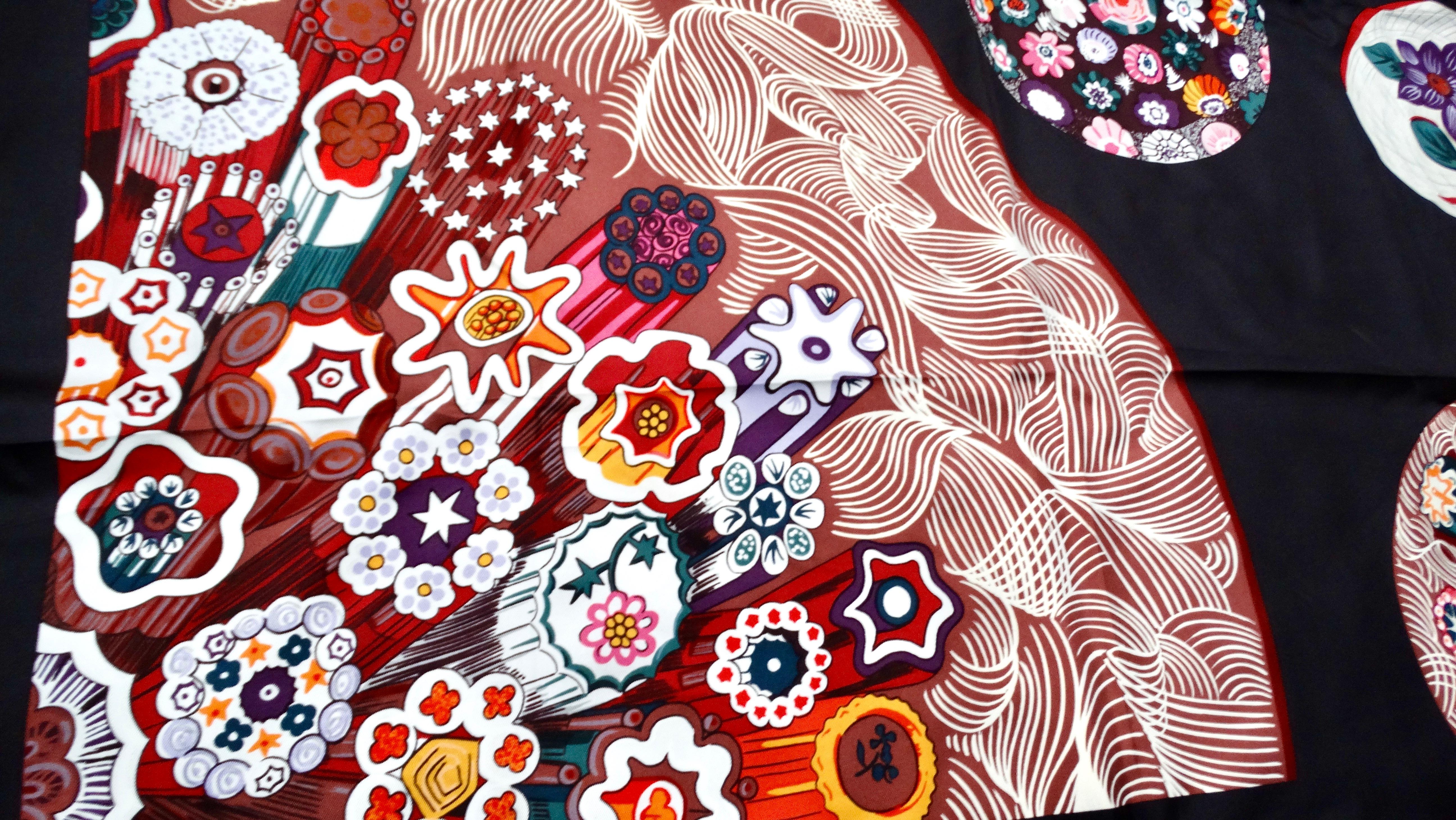 The Hermes Sulfure et Presse Papiers 90 cm Black Silk Printed Scarf is a stunning accessory that exudes elegance and sophistication. Crafted from luxurious silk, this scarf features a captivating multicolor print reminiscent of vibrant coral reefs,
