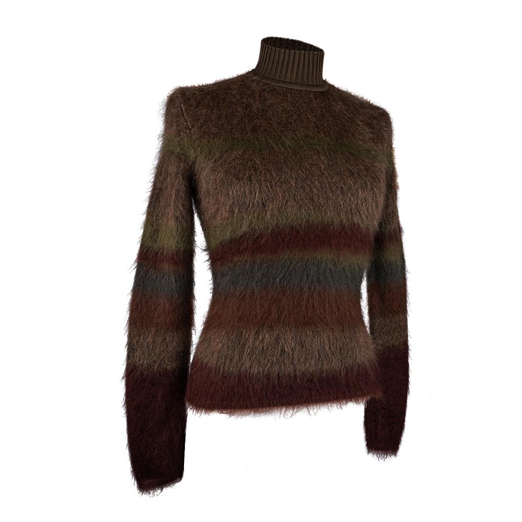 Mightychic offers an Hermes Sweater featured in jacquard knit striped earth tones.
Brushed mohair blended with wool, silk and cashmere.
Exterior is brushed mohair and silk.
The interior is wool and cashmere knit.
Mock Turtle neck is silk rib