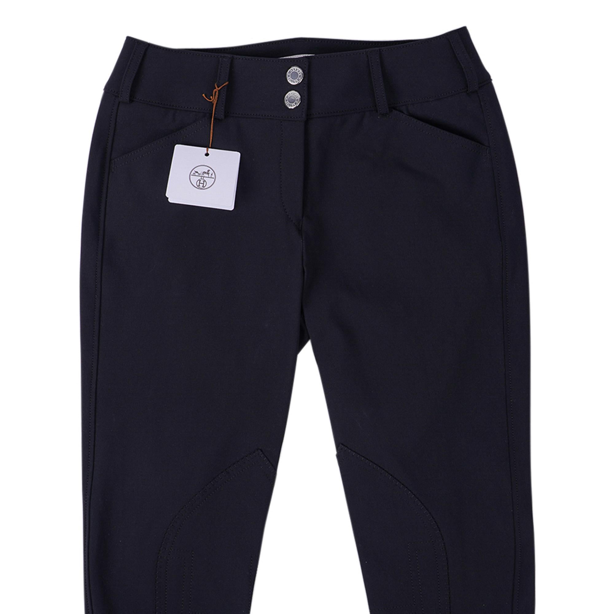 Mightychic offers Hermes Black Swing Dressage Breeches featured in Black.
These stretch riding pants are in a strong and breathable fabric.
Low rise with Orange Trim at ankle.
Silicone injected grip.
Jodhpur stitching detail inside the knee