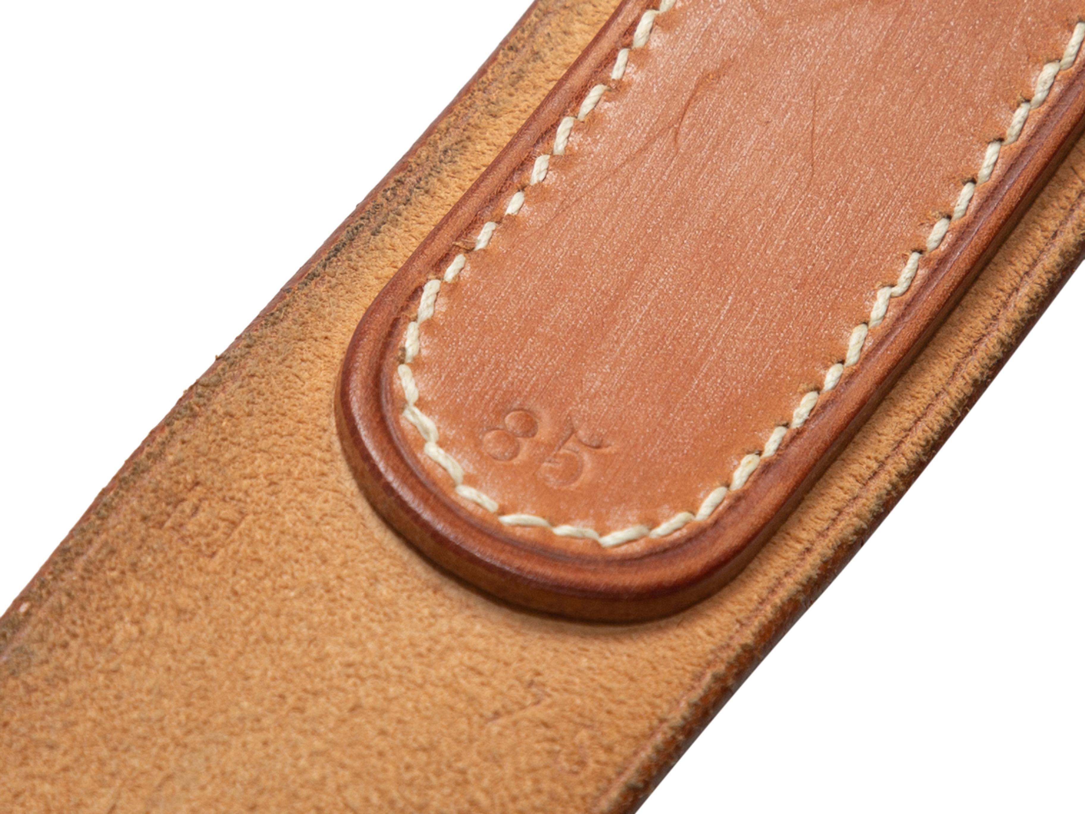 Product details: Tan leather belt by Hermes. Circa 2000. Silver-tone buckle closure. Designer size 85. 1.3