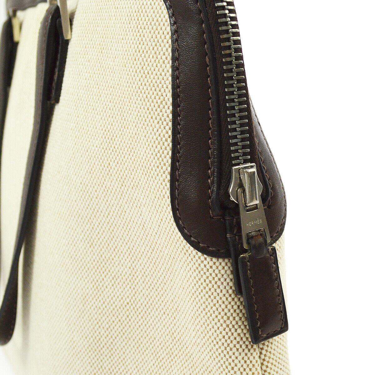 Hermes Tan Brown Canvas Carryall Bowling Evening Top Handle Satchel Tote Bag 

Canvas
Leather trim
Silver tone hardware
Date code present
Made in France
Handle drop 5