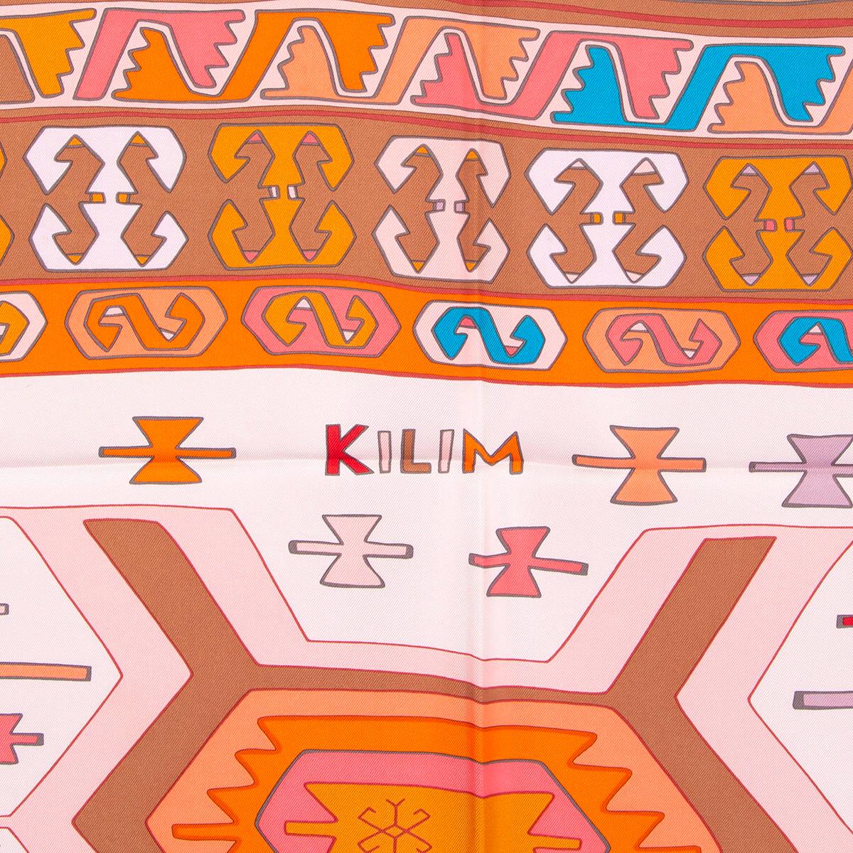 100% authentic Hermes Kilim 90 scarf by Dimitri Rybaltchenko in pale pink silk twill (100%) with tan border and details in red, turquoise, orange and brown. Has been worn and is in excellent condition. 

Measurements
Width	90cm (35.1in)
Height	90cm
