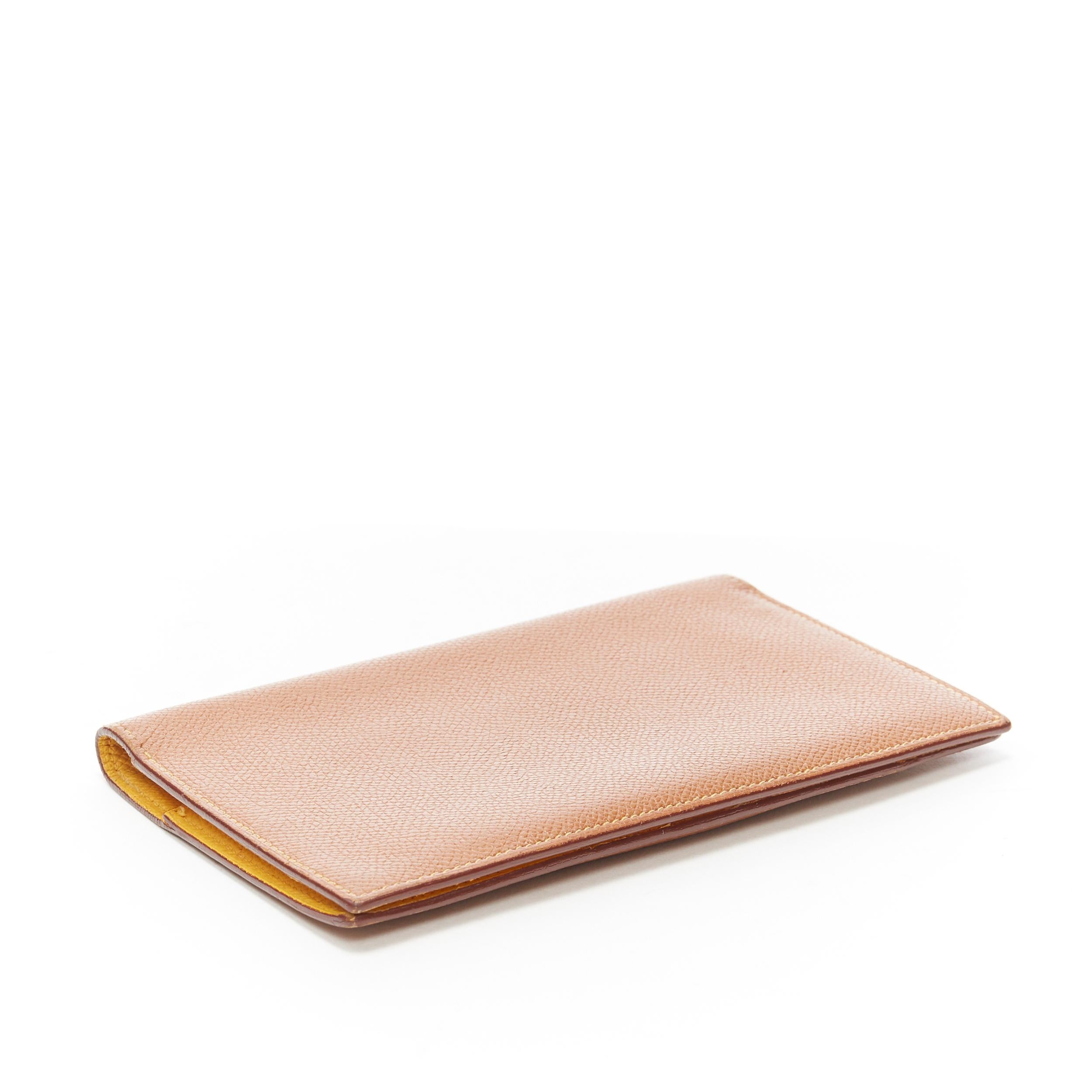 Yellow HERMES tan leather contrast yellow lining minimal long bi fold wallet