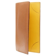 HERMES tan leather contrast yellow lining minimal long bi fold wallet